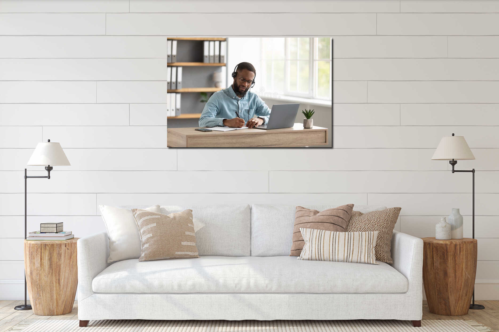 Serious busy millennial african american bearded guy manager in glasses, headphones work or study with laptop interior mockup