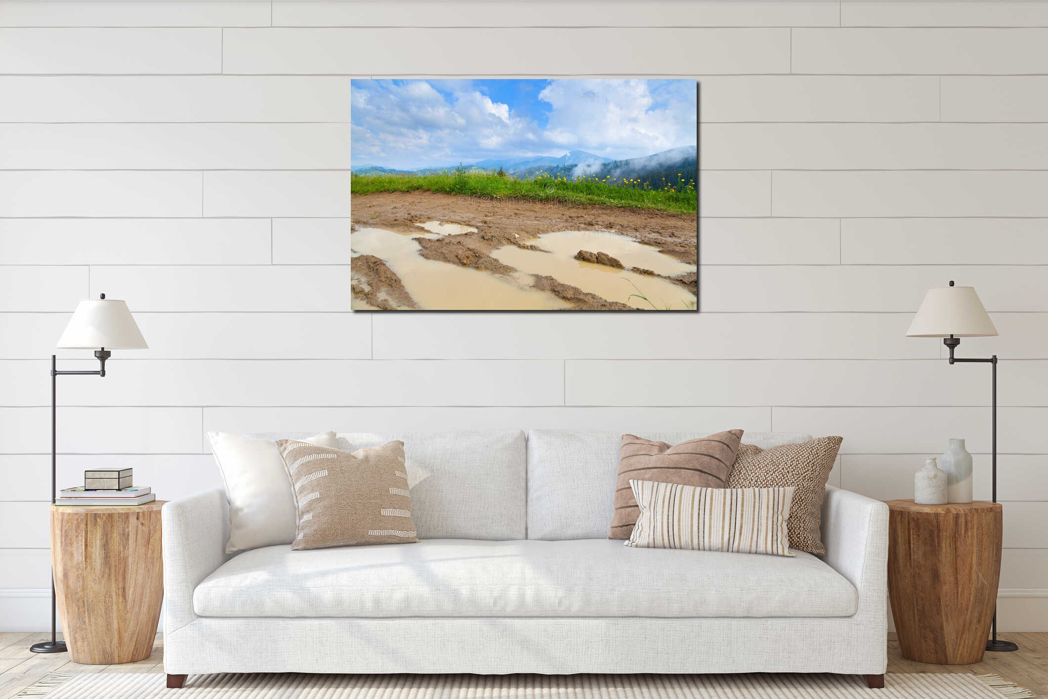 Muddy road along mountain meadow, bright blue sky over mountains. Carpathians. interior mockup