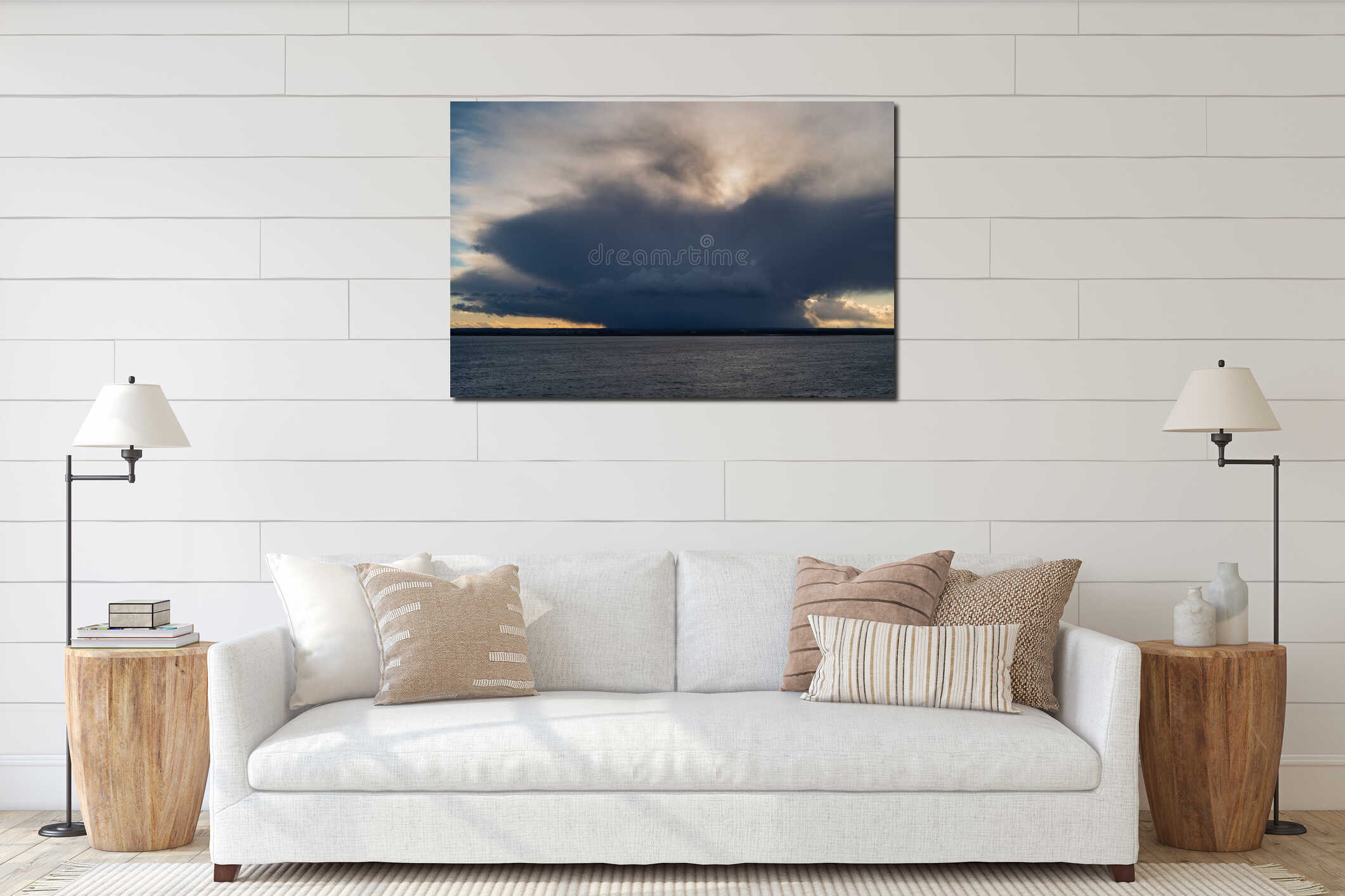 A dramatic image of a rain cloud on the horizon above the sea and a peninsula interior mockup