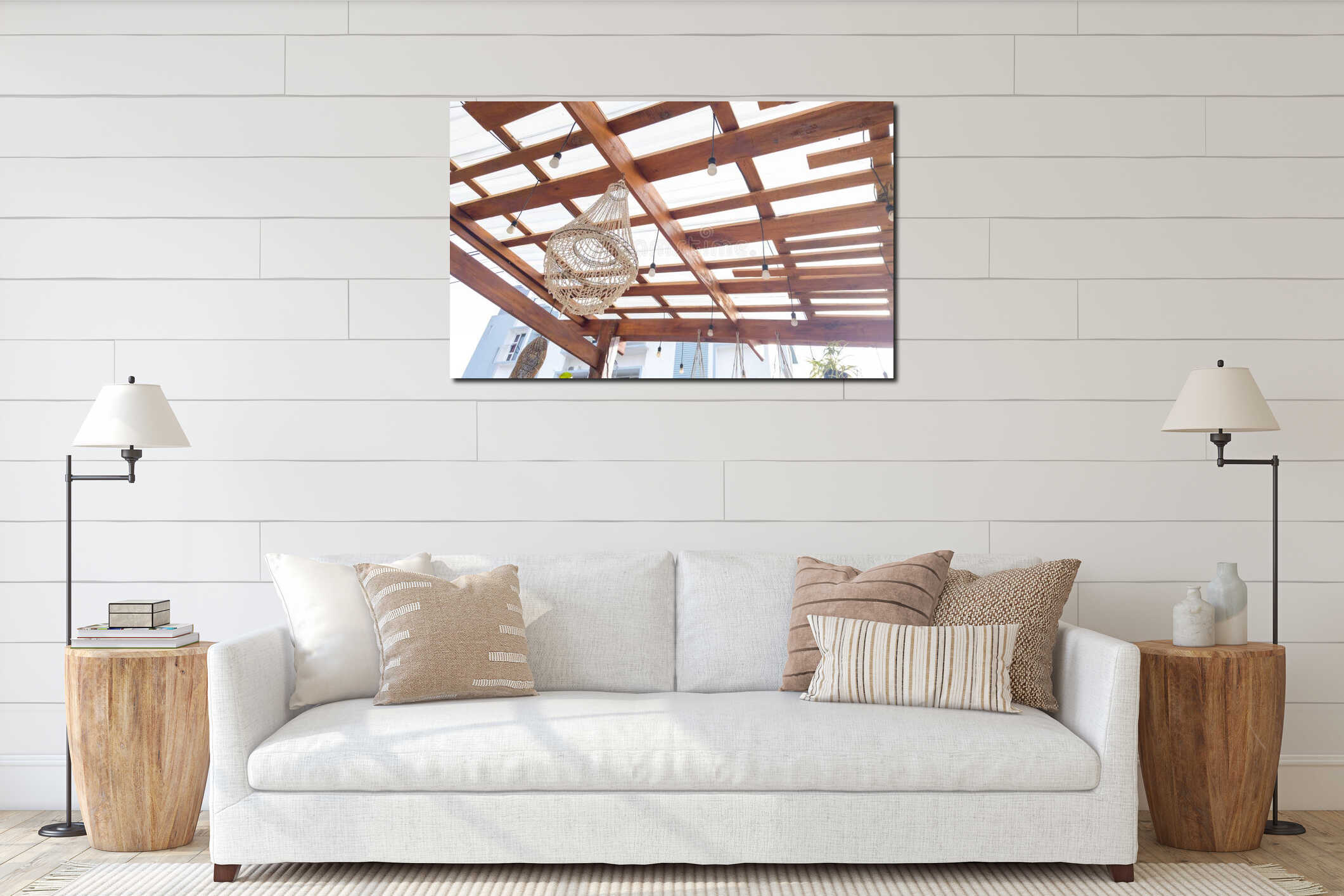 Wooden pergola roof with exposed beams, hanging light bulbs, and a decorative woven rattan lampshade in a bright outdoor space, interior mockup