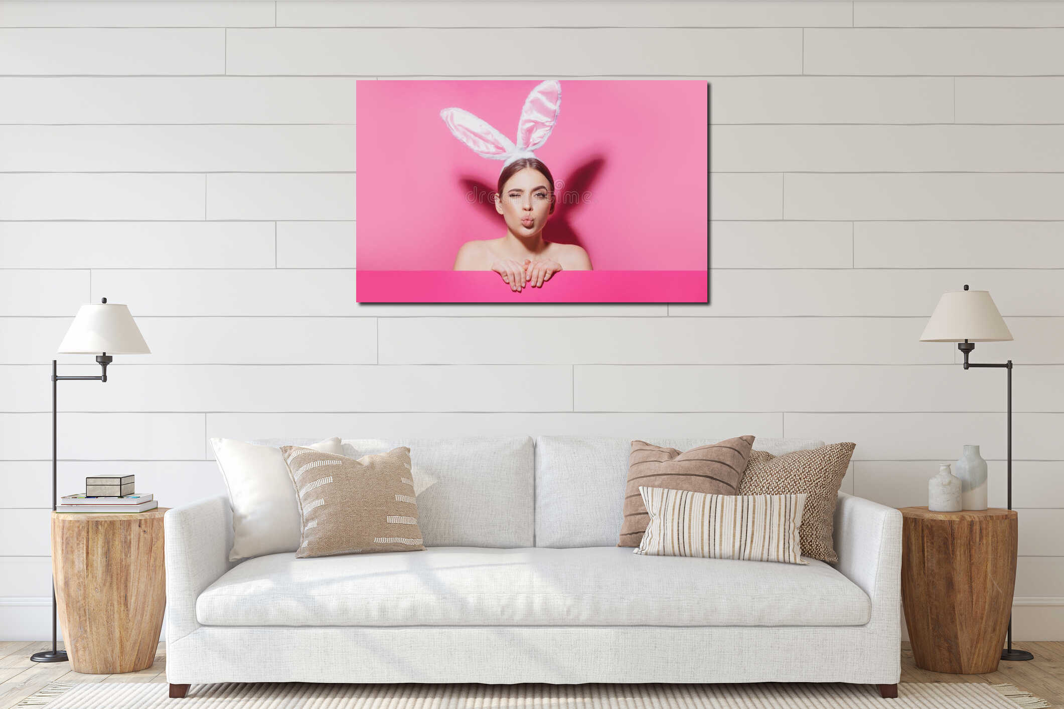 Close-up portrait of attractive cheerful girl wearing pink ears, air kiss. Easter bunny woman. interior mockup