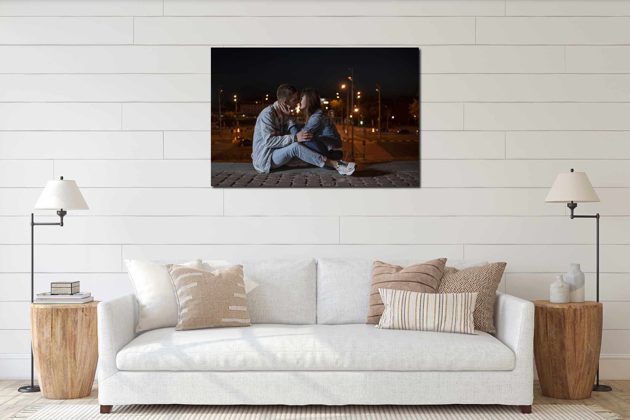 Guy and girl are kissing against the backdrop of the evening city and lanterns interior mockup