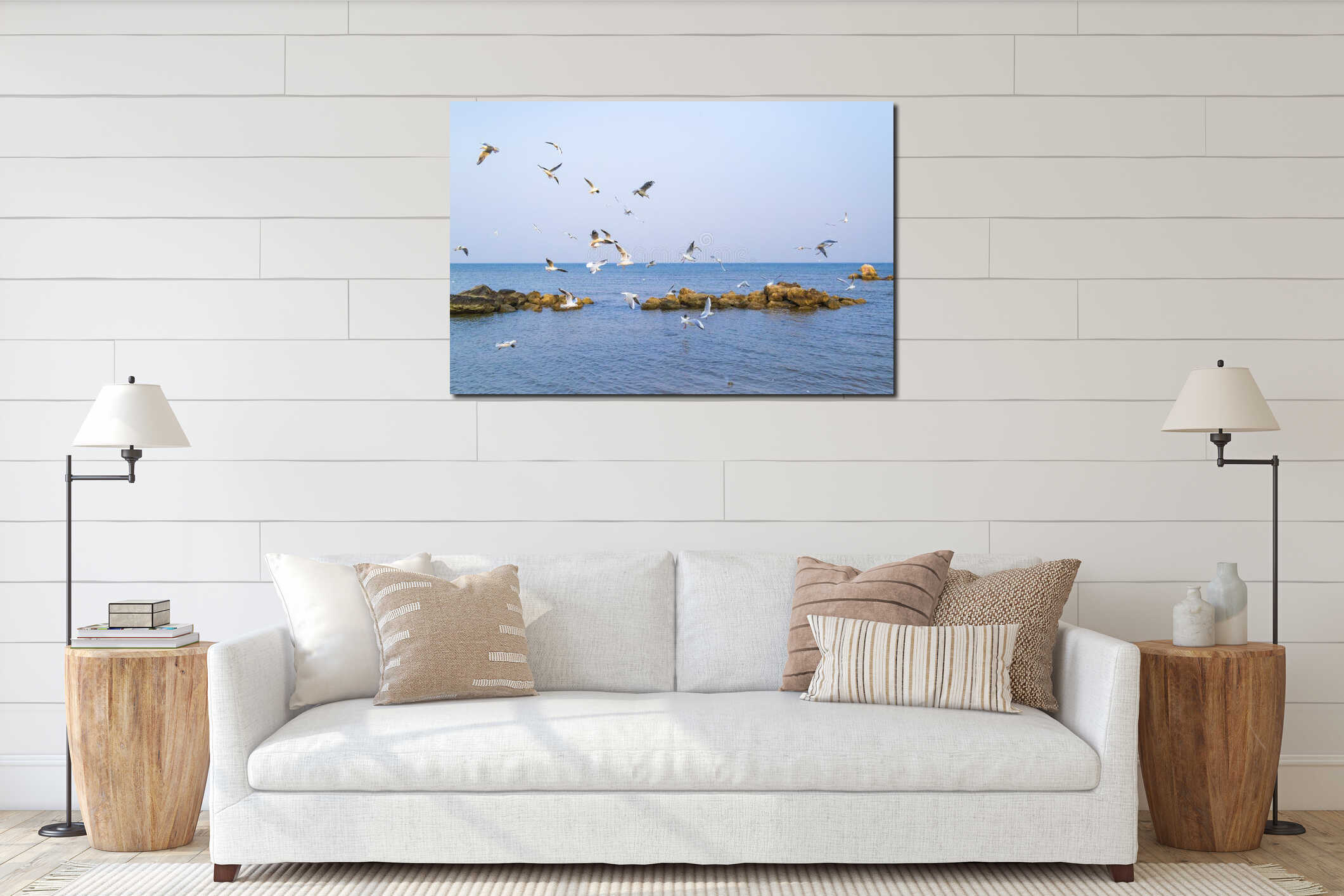 A flock of seabirds flying over the sea interior mockup
