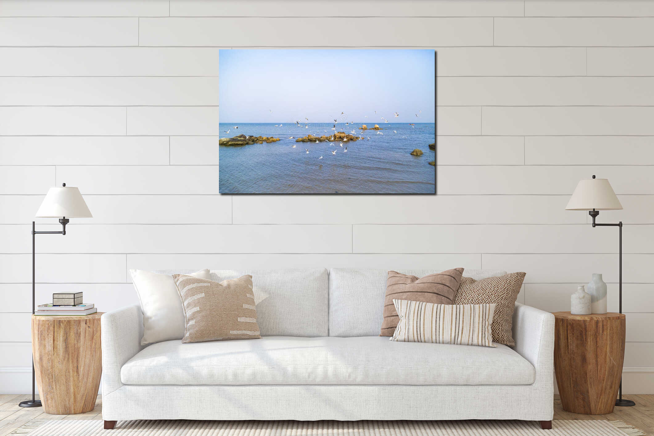 A flock of seabirds flying over the sea interior mockup