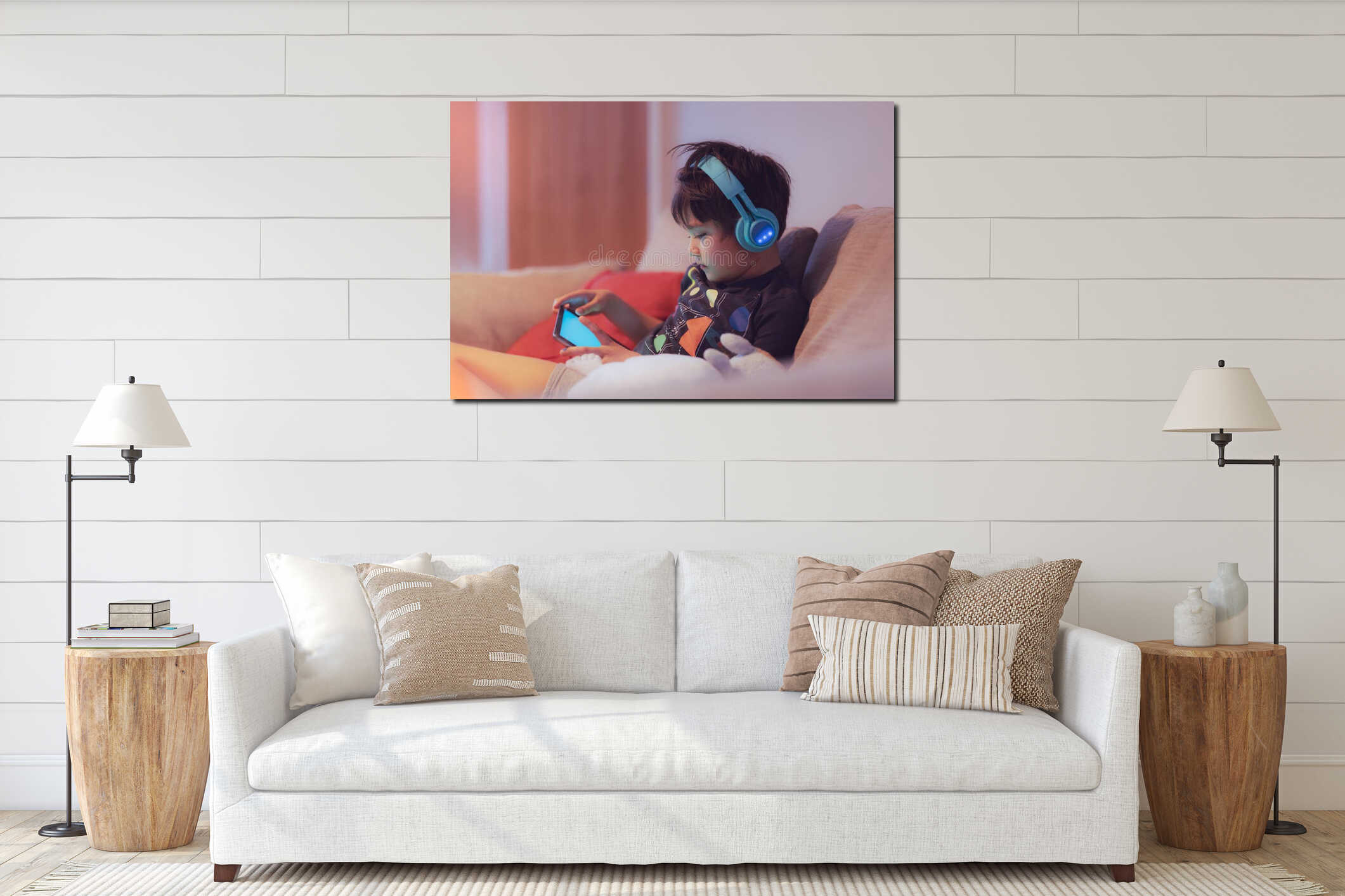 Cinematic night portrait young boy wearing headphone for playing game online on internet with friend, Kid sitting on sofa watching interior mockup