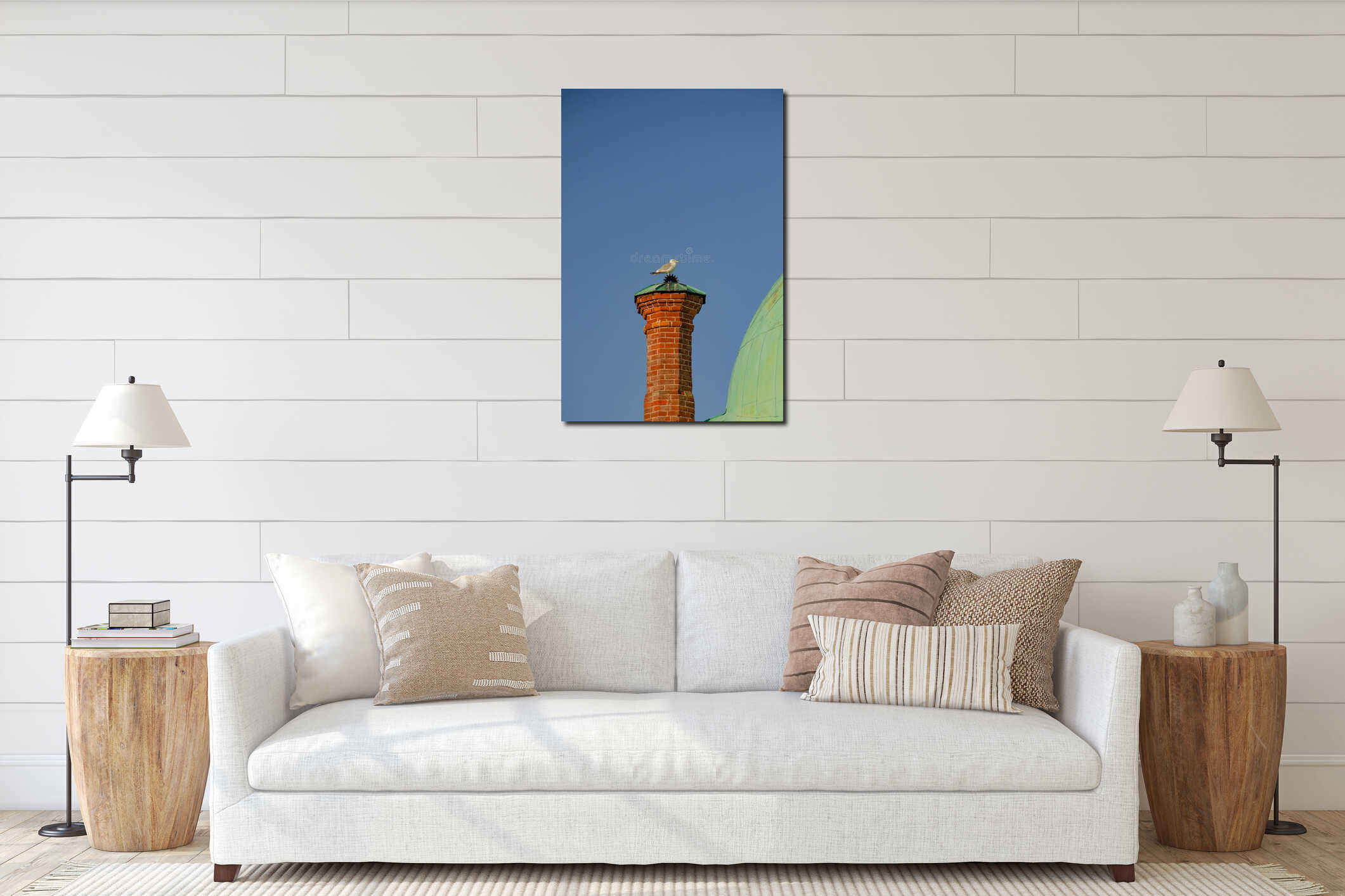 A seagull sits on a red brick chimney against a blue sky interior mockup