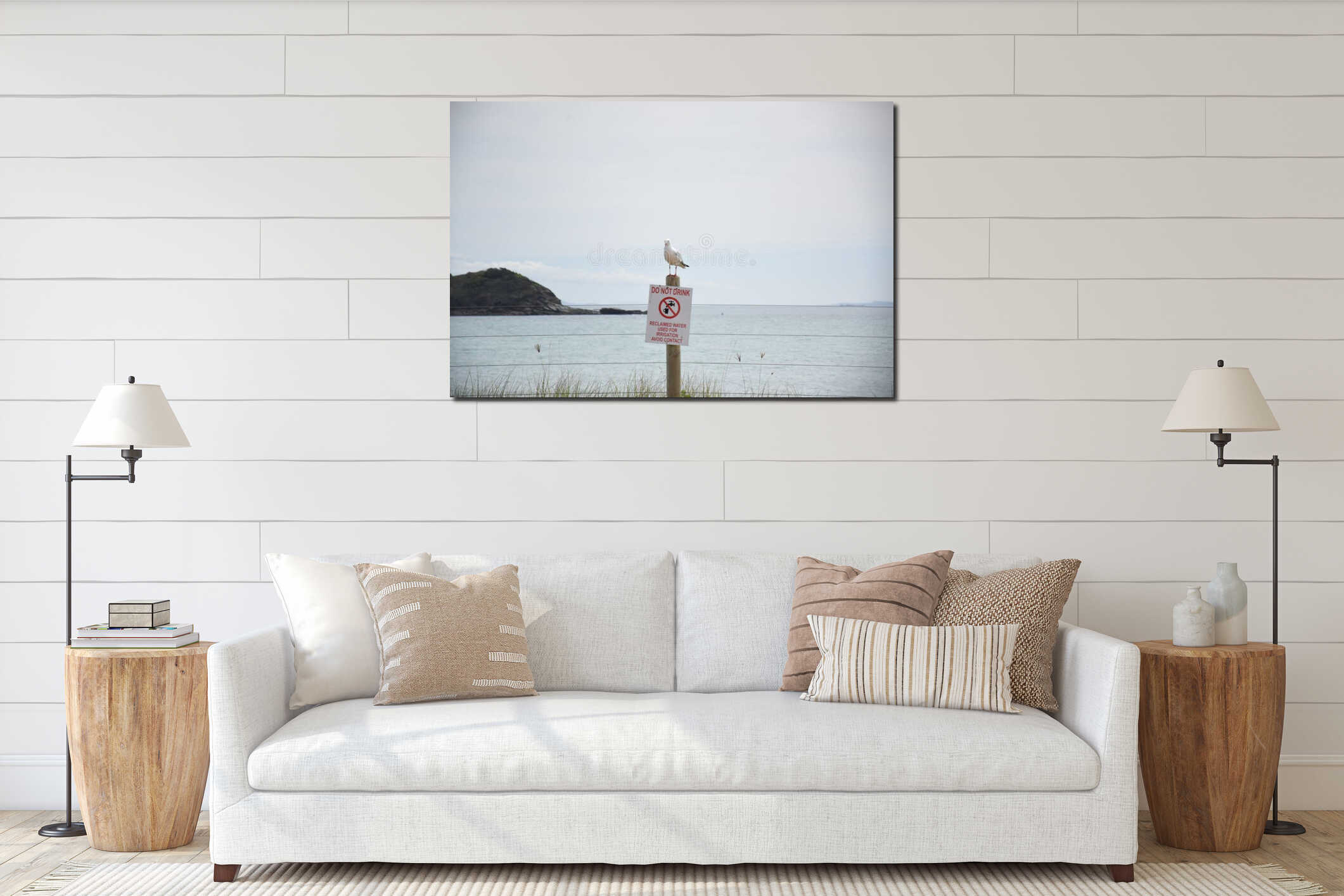 Seagull standing on top of sign with ocean interior mockup
