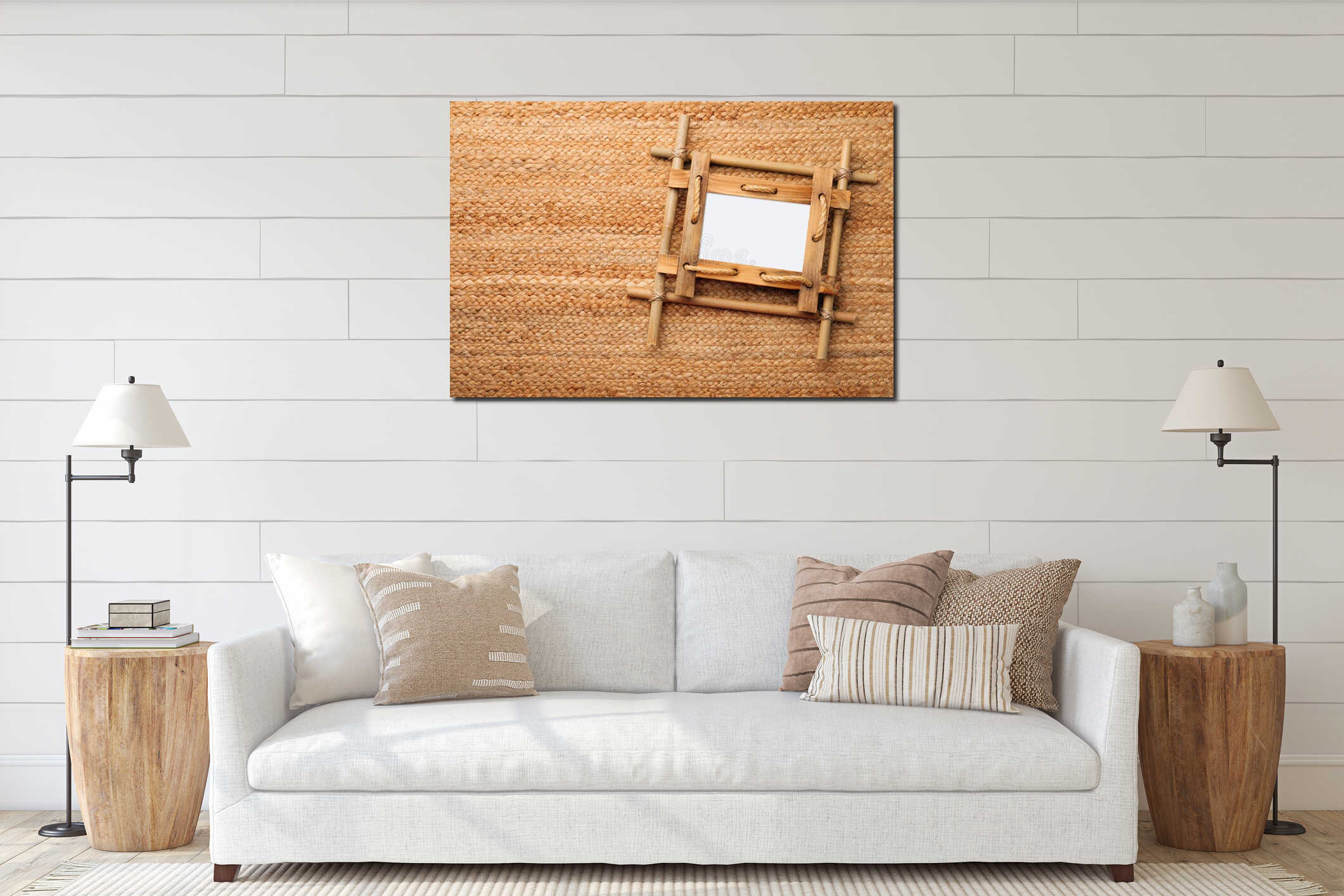 Empty bamboo frame on wicker straw background, top view. Space for text interior mockup