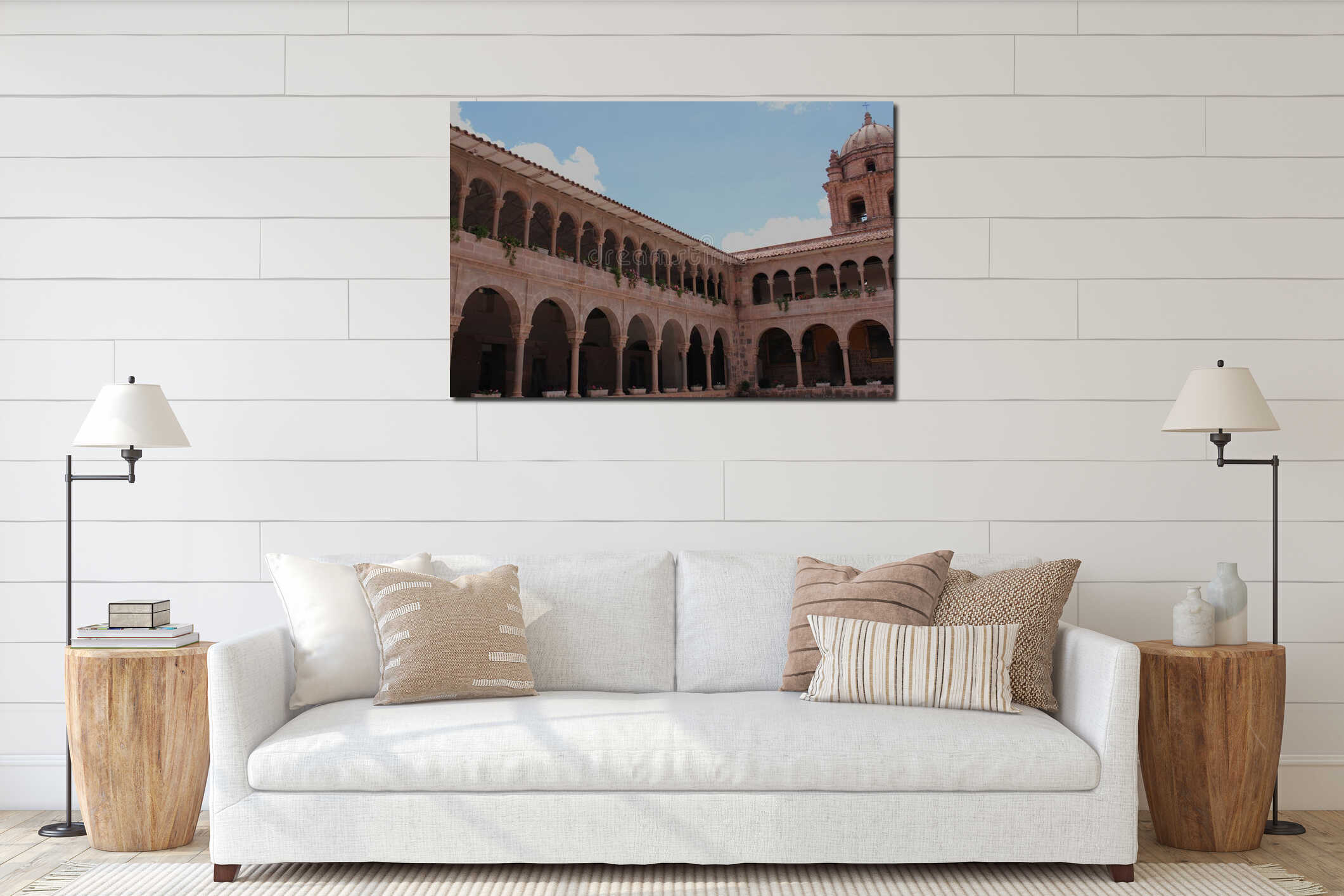 A bell tower atop a two story stone building lined with columns and arches at the Belmond Monasterio Hotel in Cusco interior mockup