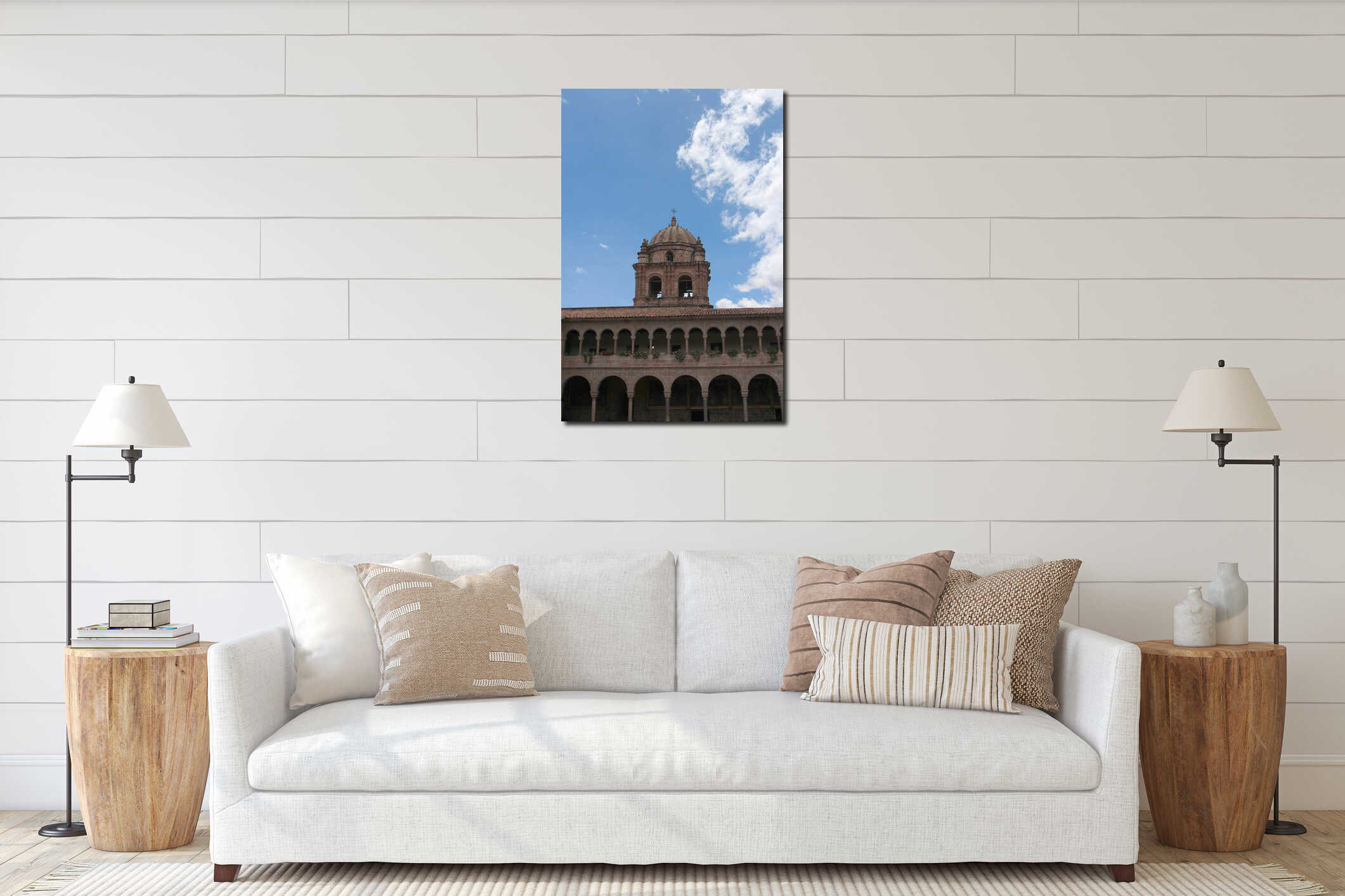 A bell tower atop a two story stone wall lined with columns and arches at the Belmond Monasterio Hotel in Cusco, Peru interior mockup