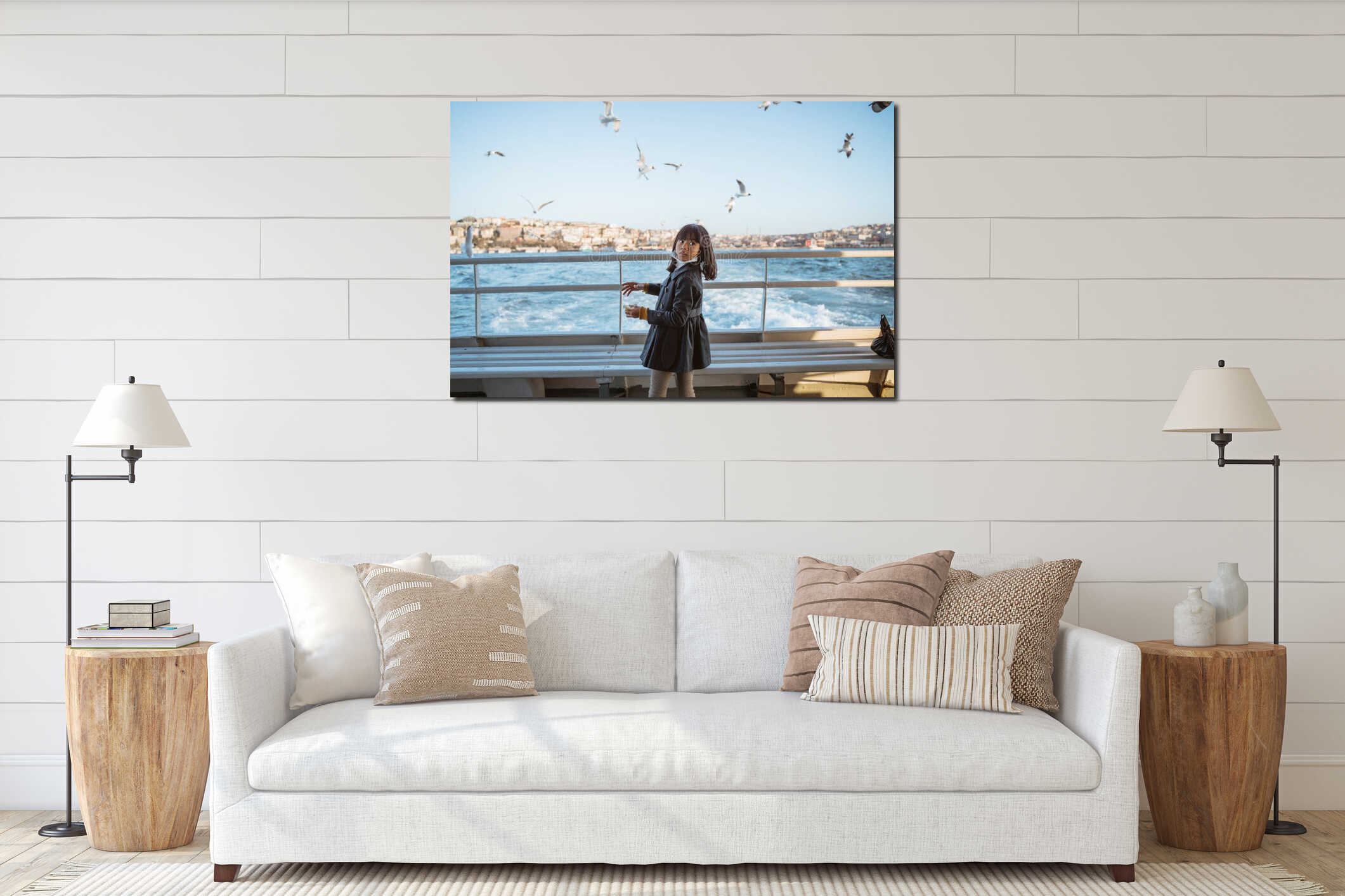 girl feeding seagull while going by ferry boat in interior mockup