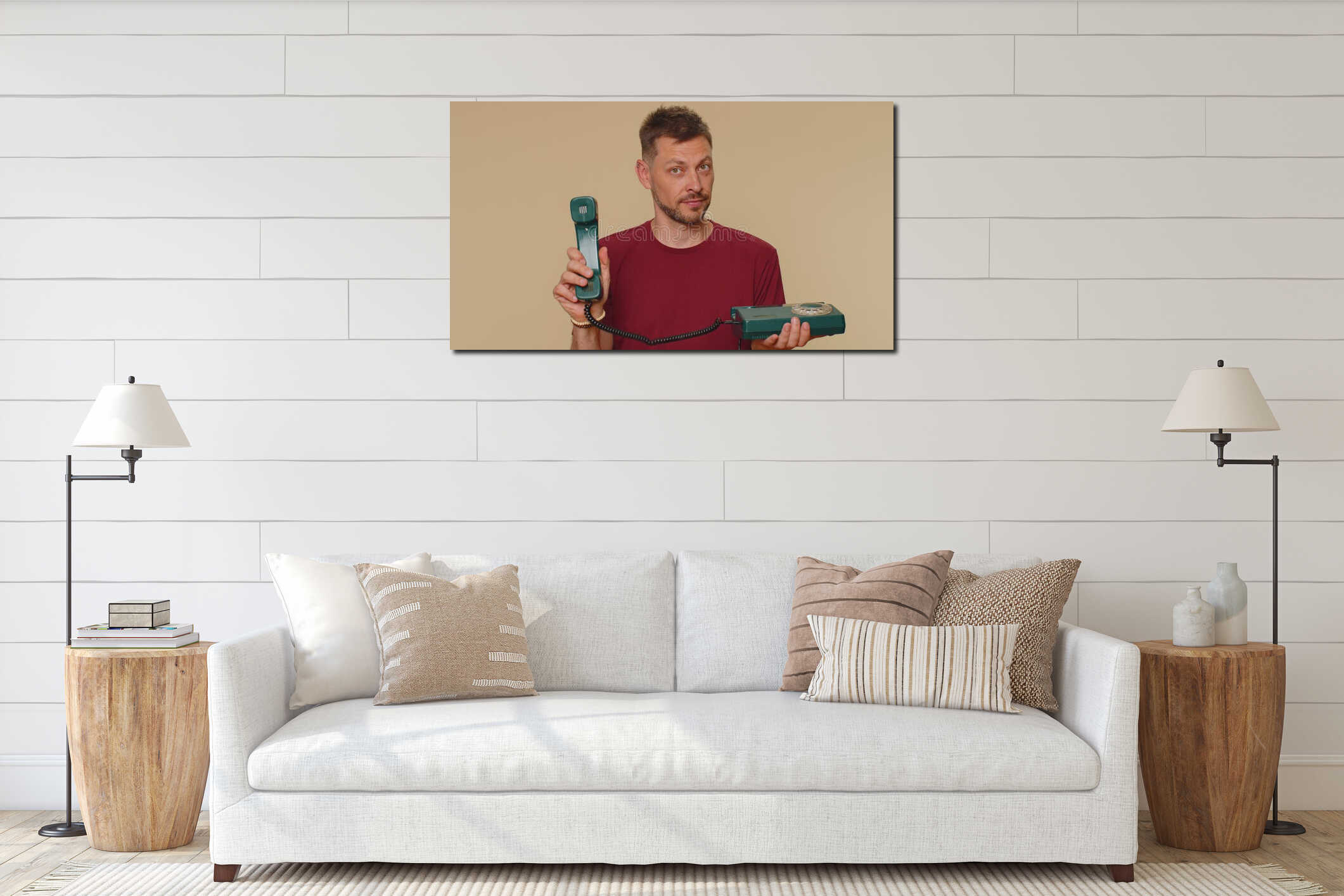 Handsome man in red t-shirt talking on wired vintage telephone of 80s says hey you call me back interior mockup