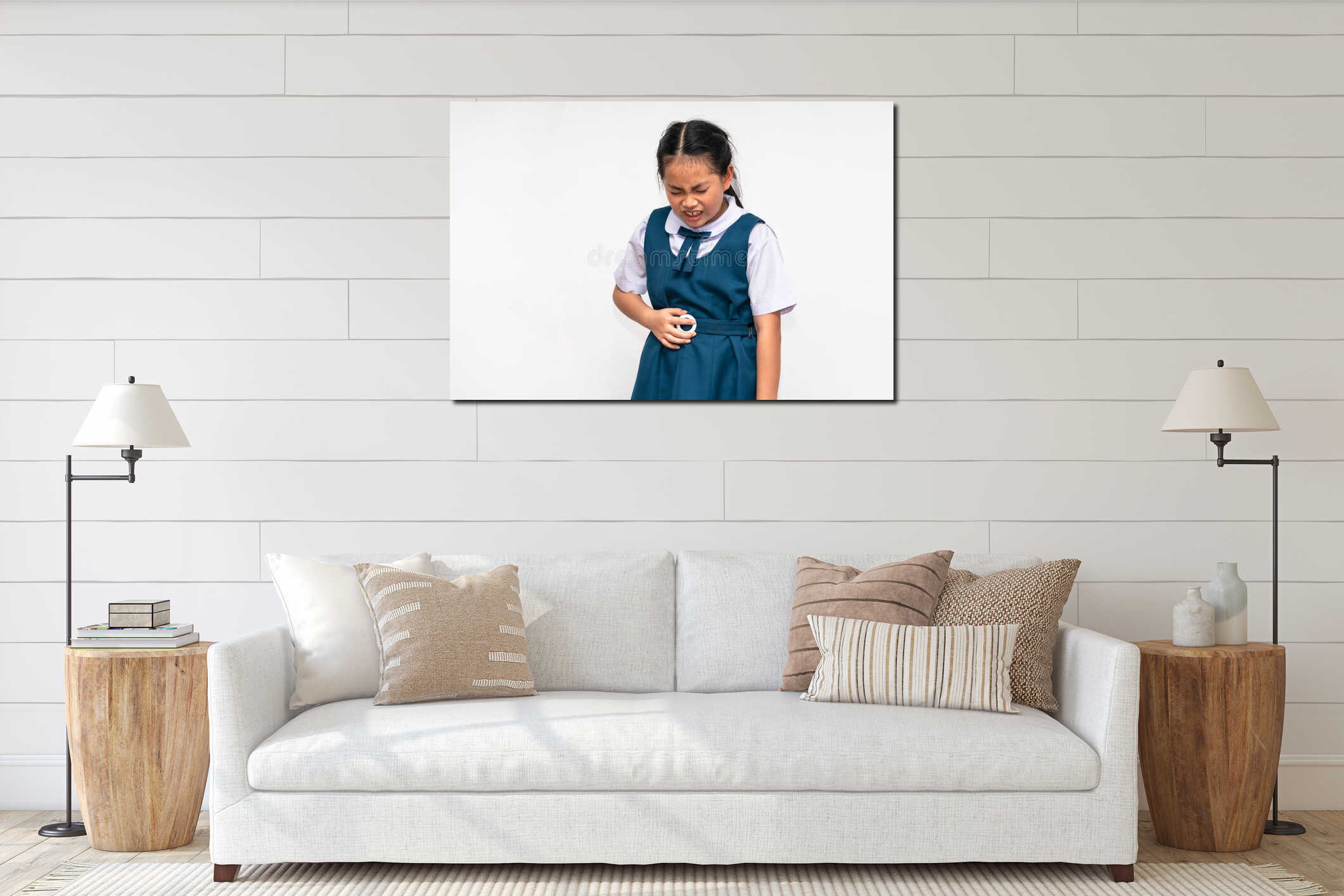 Little Asian student girl is stomach ache, unidentified school uniform, isolated portrait of Asian child girl with stomach pain on interior mockup