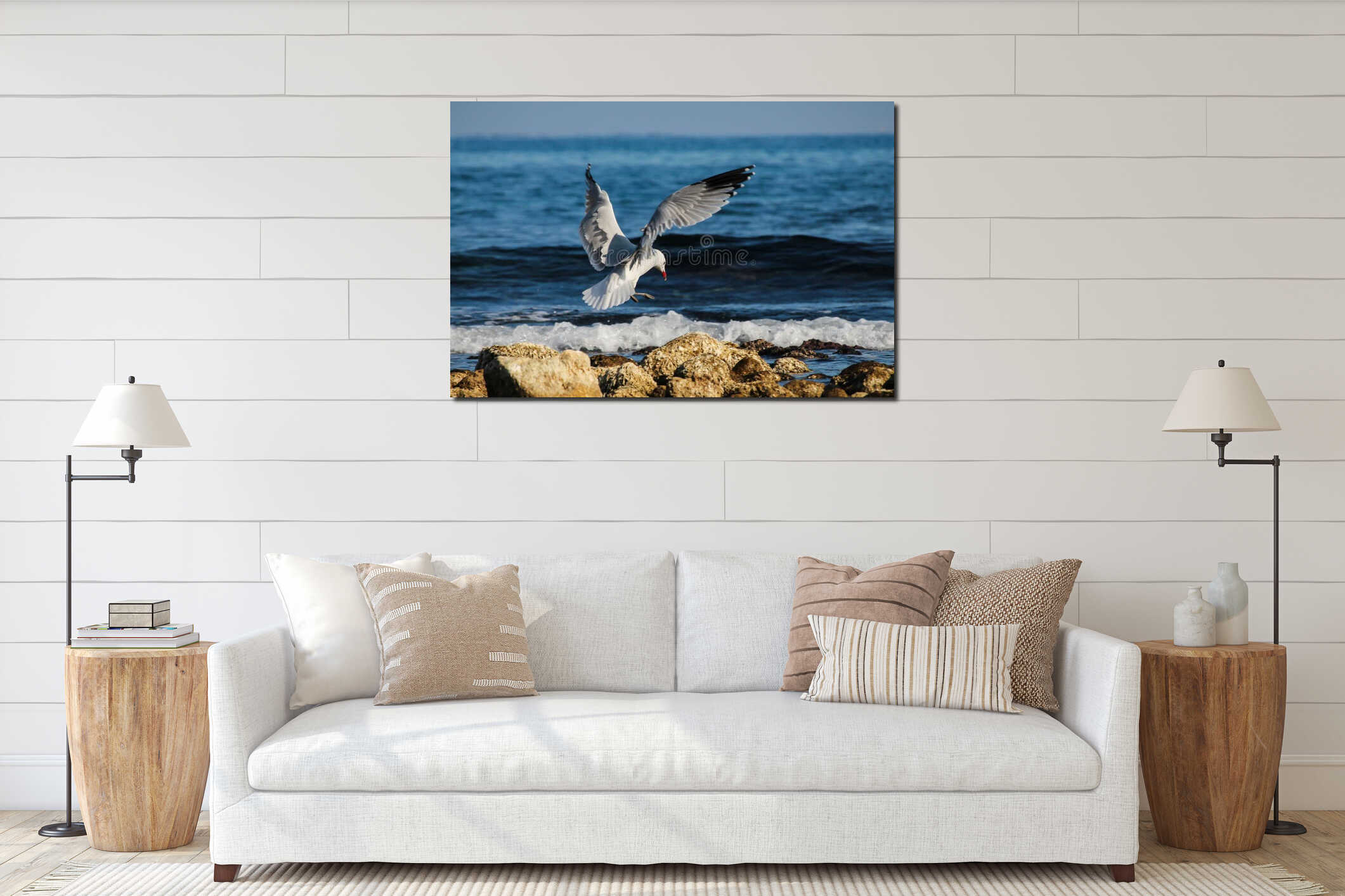 Seagull flying over a beautiful rocky sea shore on a bright sunny day interior mockup
