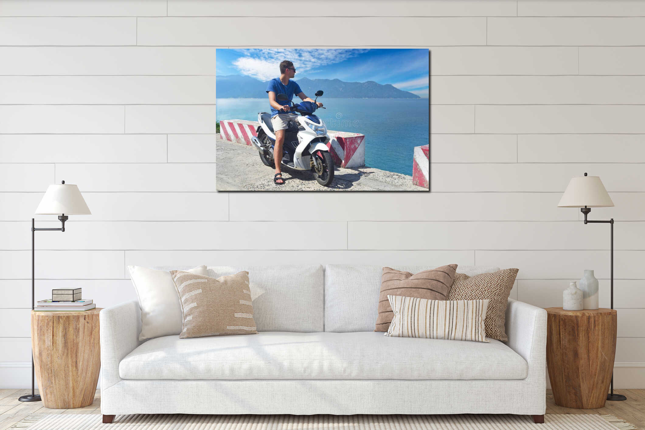 Young man motorbike driver sitting and holding helmet against south south china sea in vietnam interior mockup