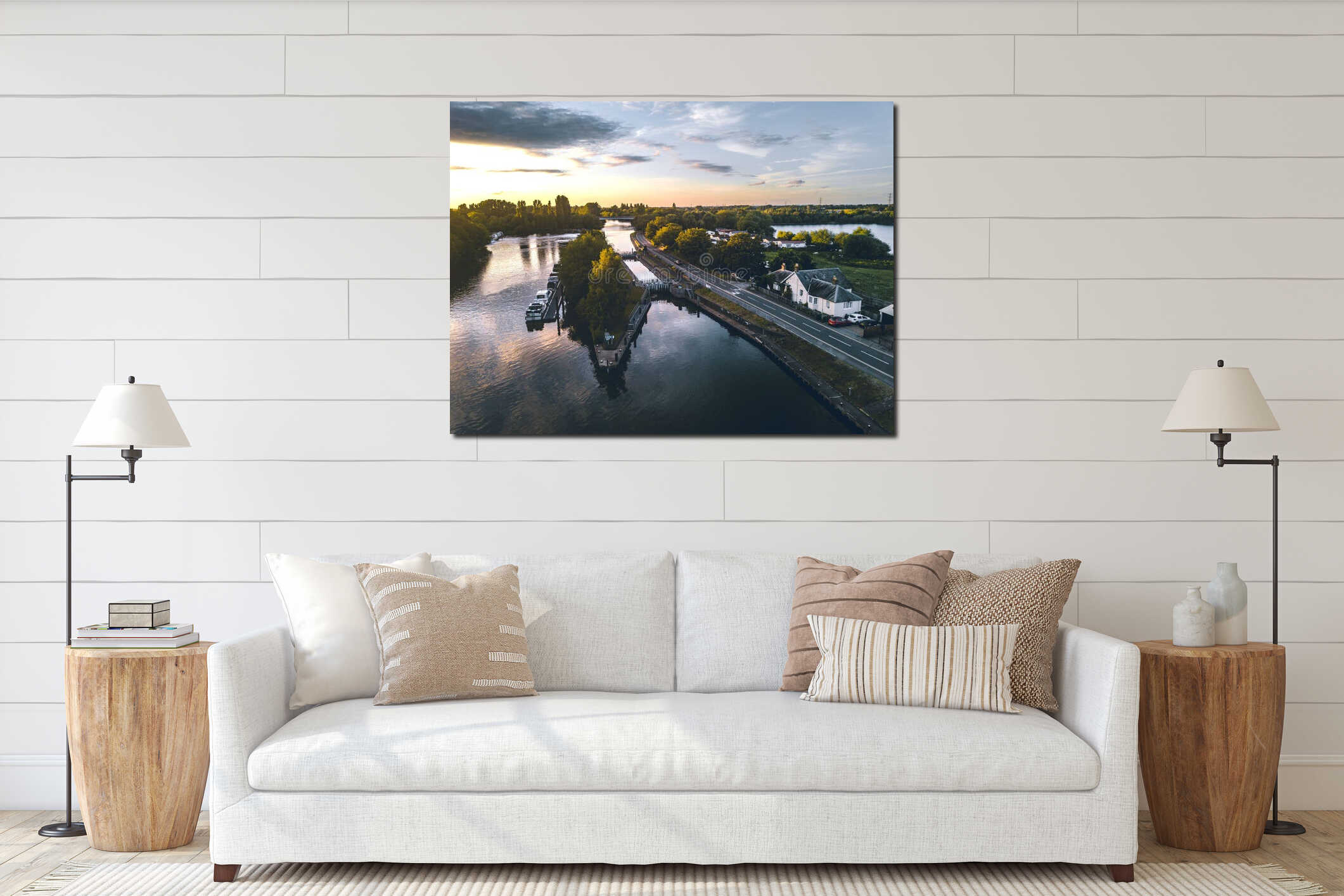 Aerial shot of the narrow road near the coast with boats on the water at sunset interior mockup