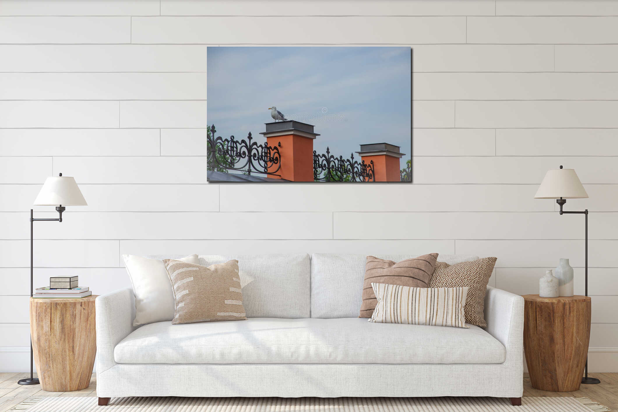 seagull cormorant sitting on a fence against a blue sky interior mockup