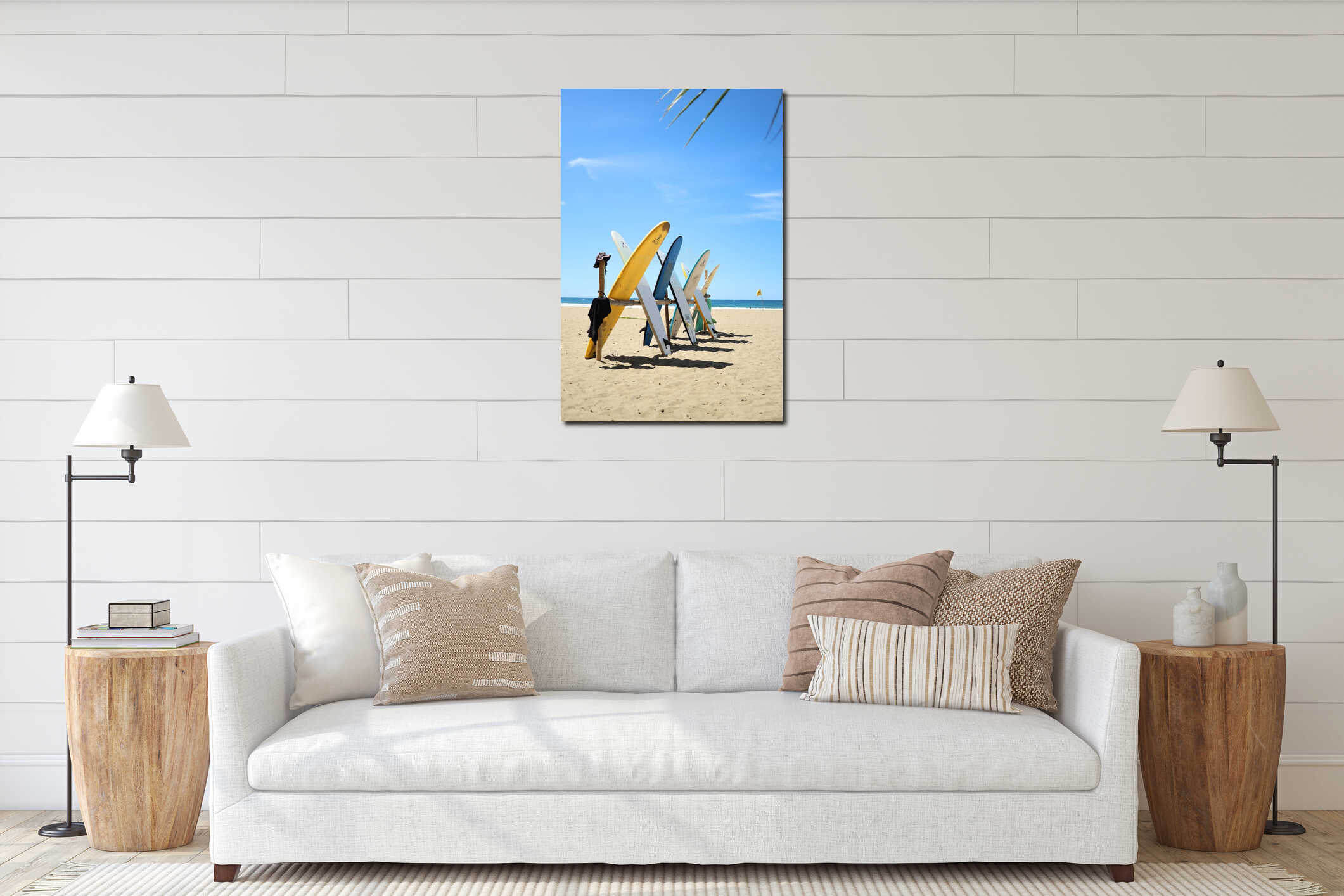 Vertical shot of unfiltered surfboards on the sandy beach with blue sky and sunlight background interior mockup