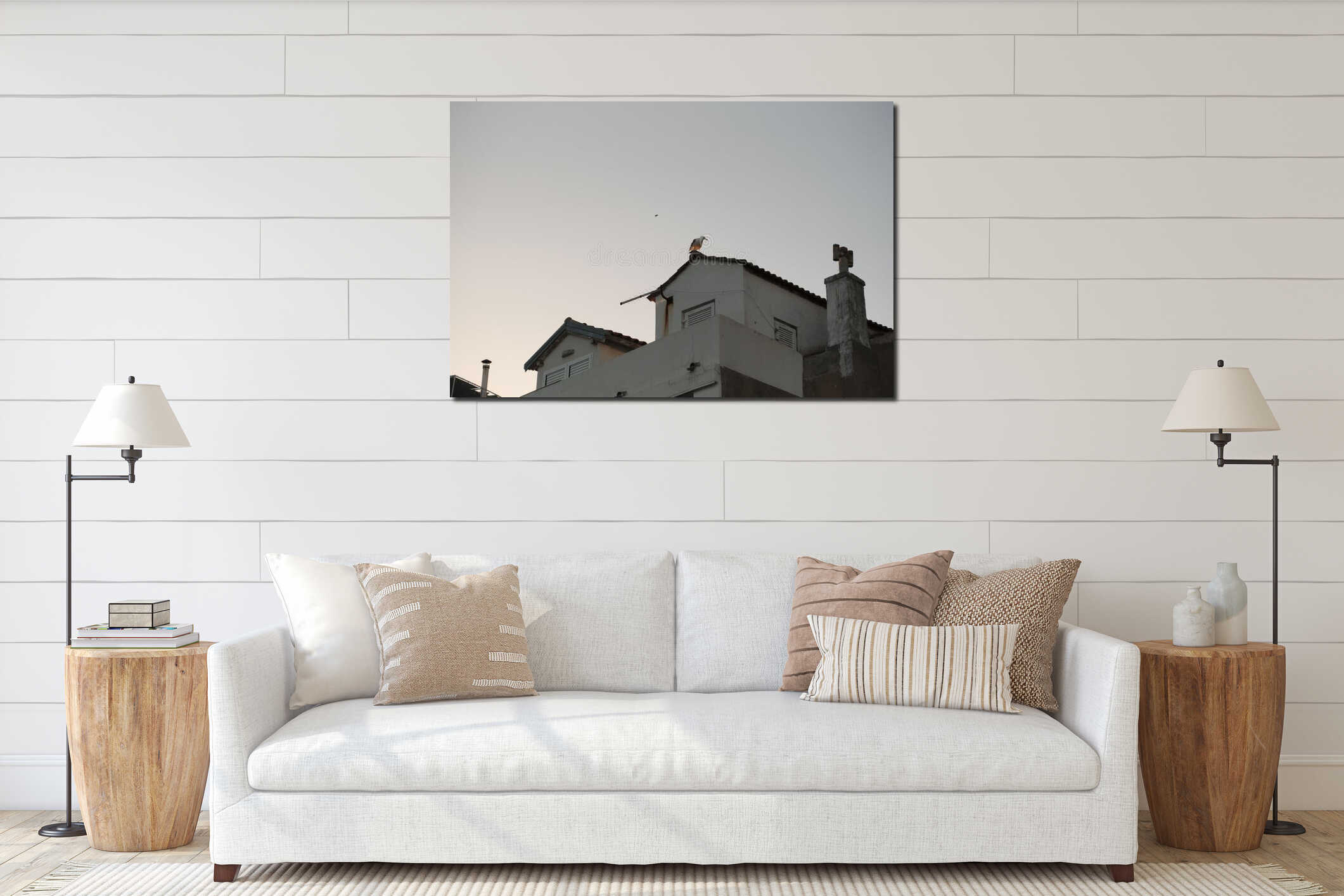 Seagull perched on the rooftop of a white building interior mockup