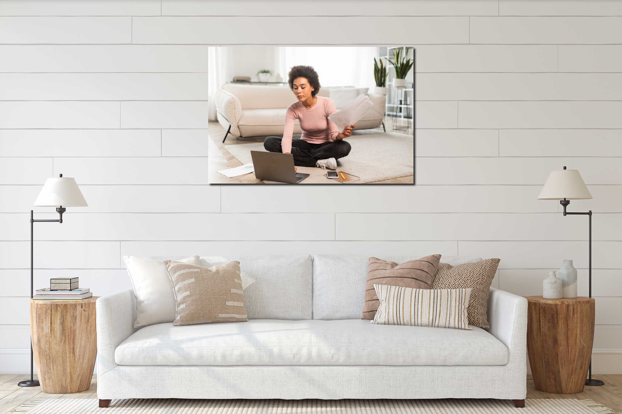 Serious busy millennial african american female work with documents, sit on floor with laptop in bright living room interior mockup
