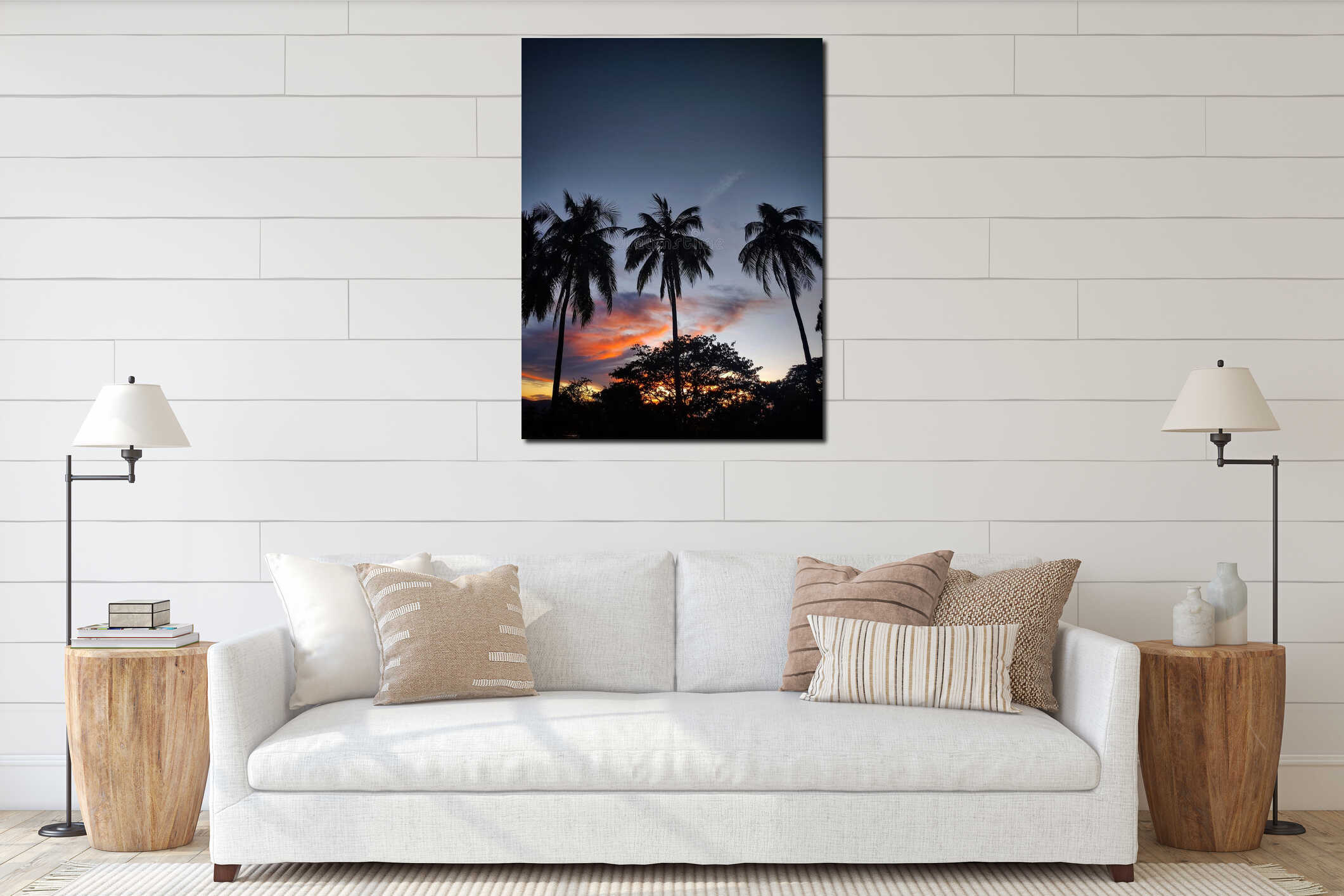 Vertical low angle shot of silhouettes of palm trees under a sunset sky interior mockup