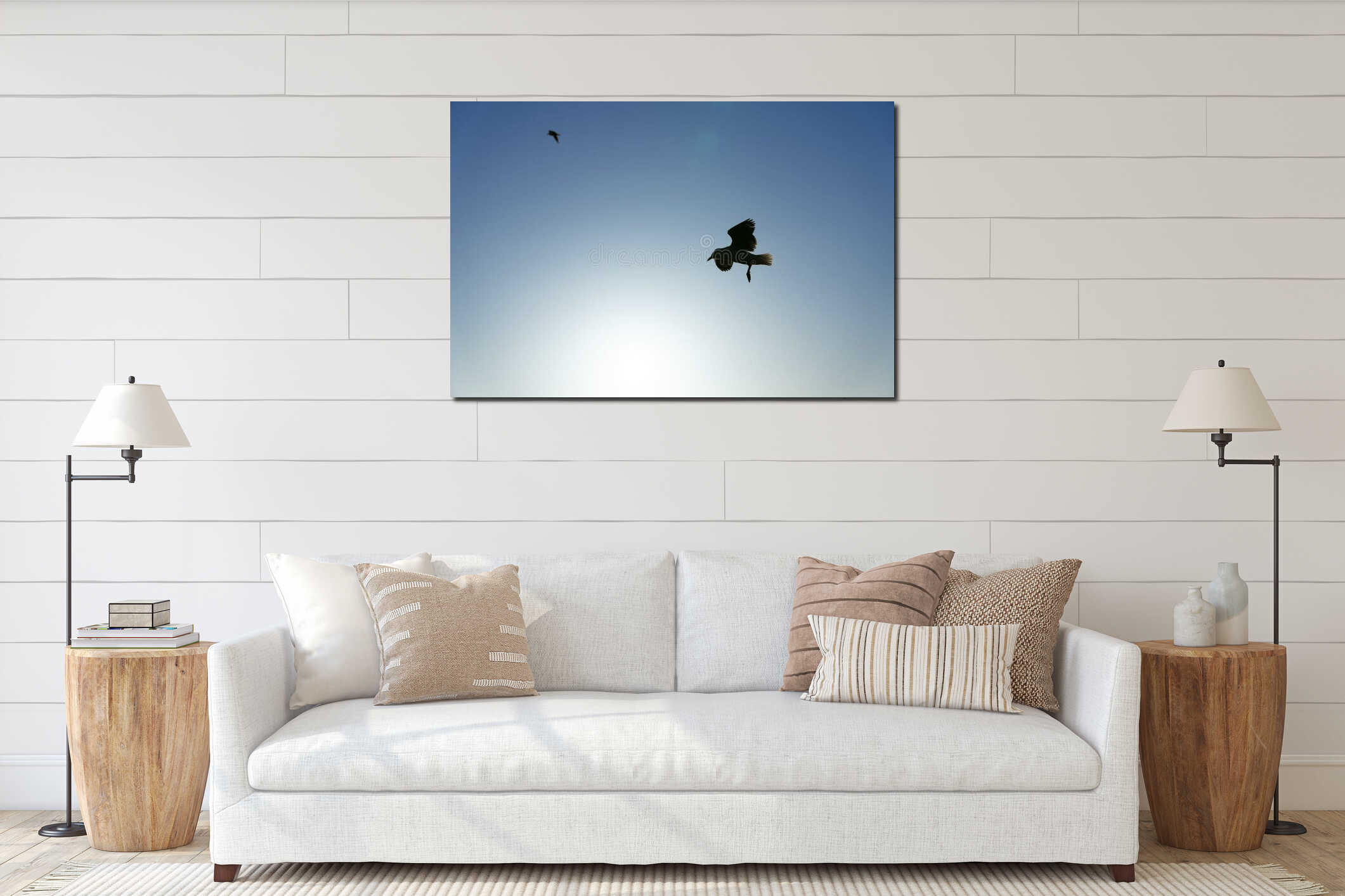 In silhouette seagull in flight against blue sky interior mockup