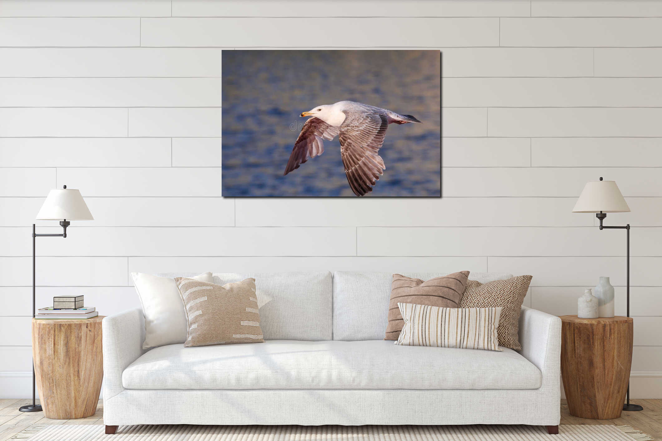 Closeup of a seagull in flight over sea against blur background interior mockup