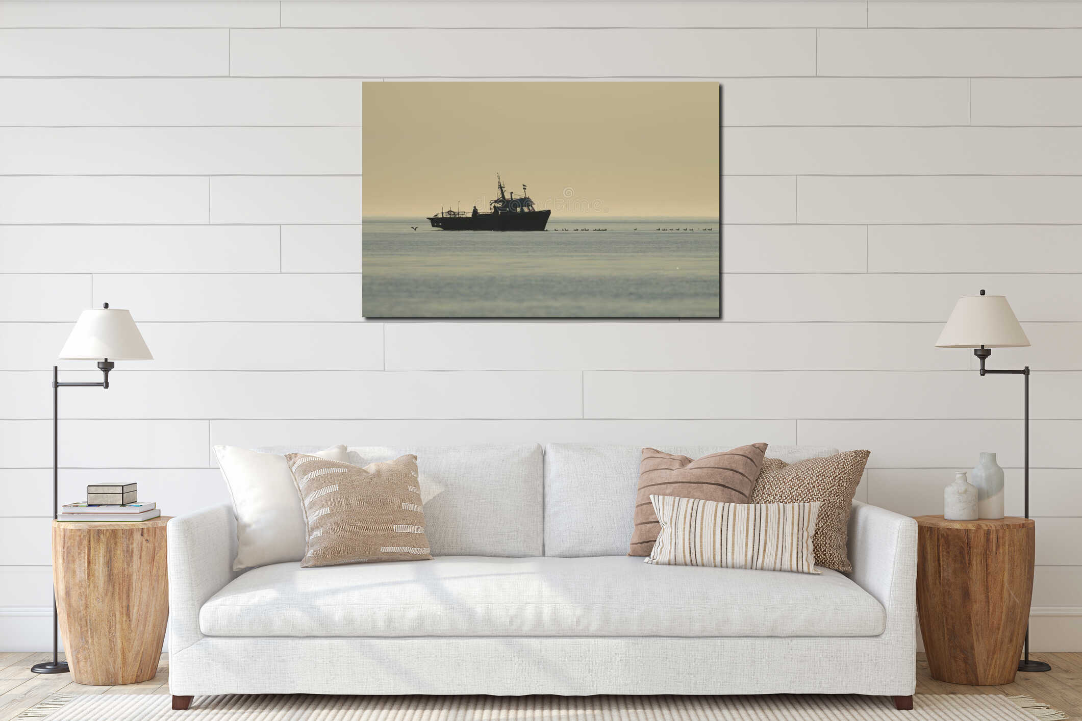 Several gulls or seagulls following a fishing boat in silhouette interior mockup