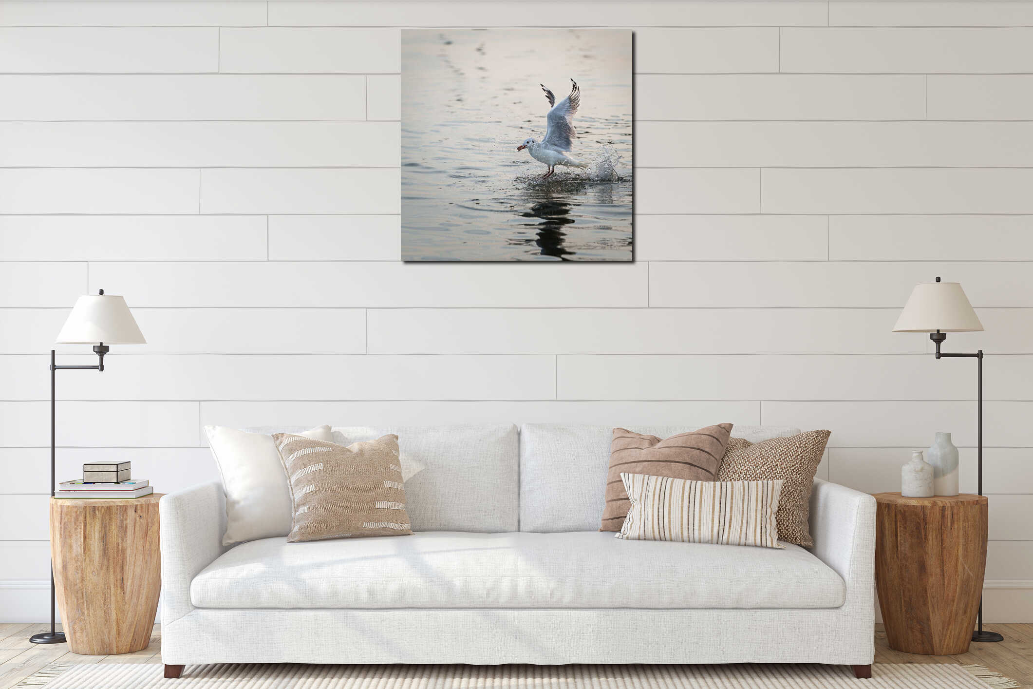 Wildlife, Larus Charadriiformes or White Seagull hunting on sea, flies over the water has food in its beak and eating, it spreads interior mockup