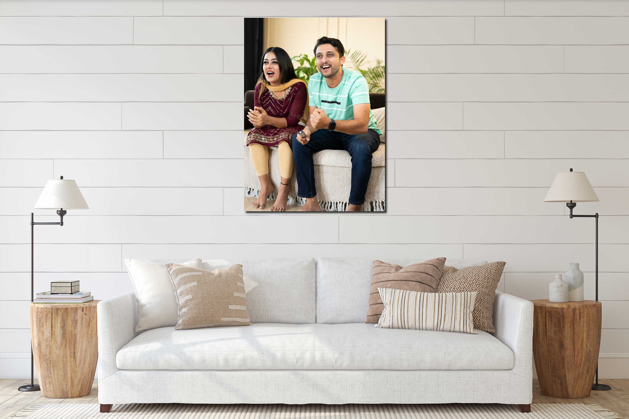 Vertical full shot of excited cheerful couple shouting while watching live cricket sports match on tv or television at interior mockup