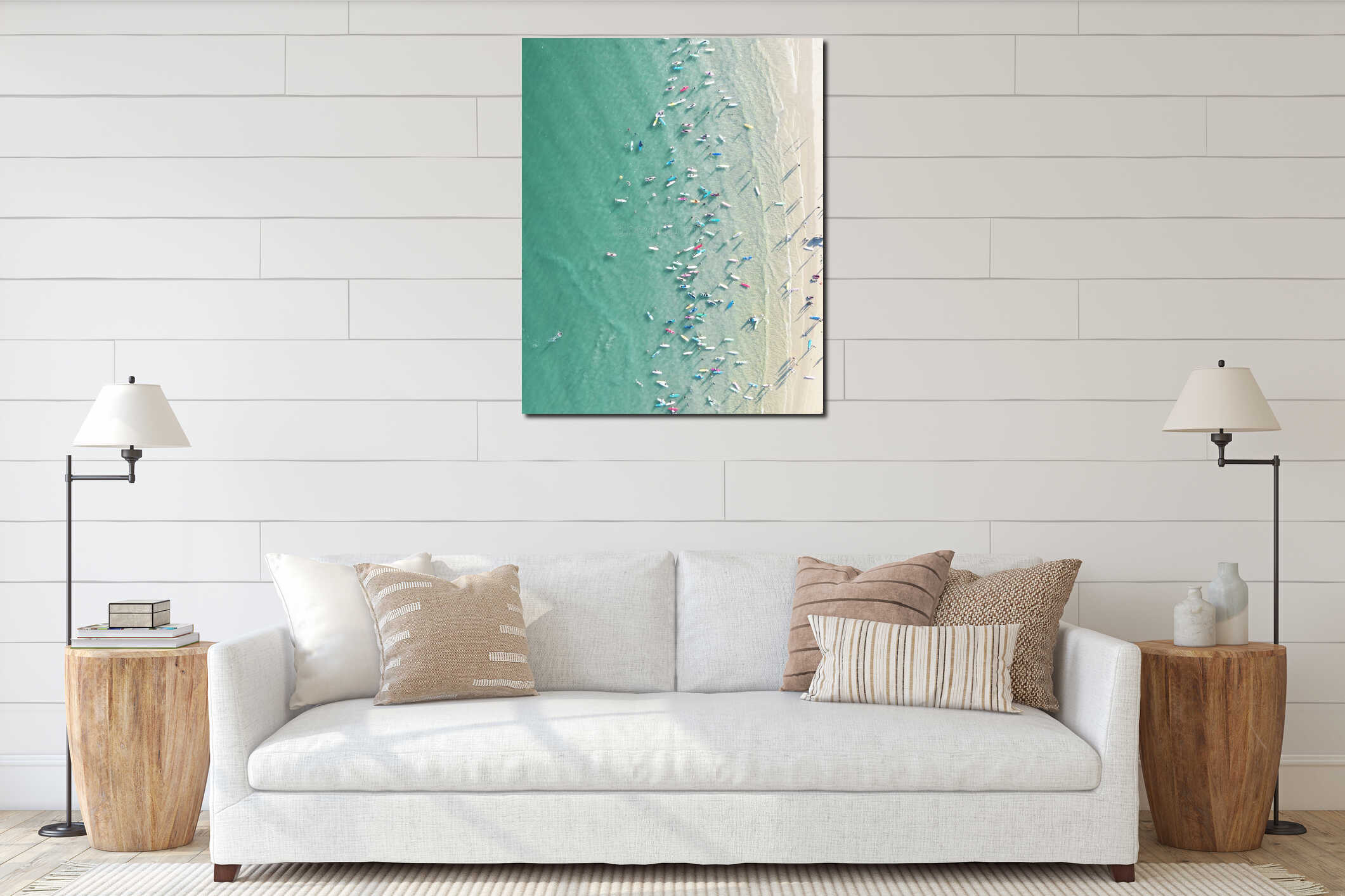 Aerial top shot of various surfboards and kayaks on a clear seawater surface near the coastline interior mockup