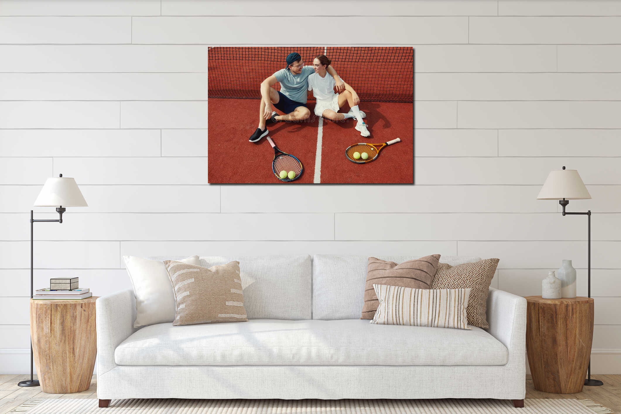 Top view of happy couple sitting on the tennis court floor with rackets and balls interior mockup
