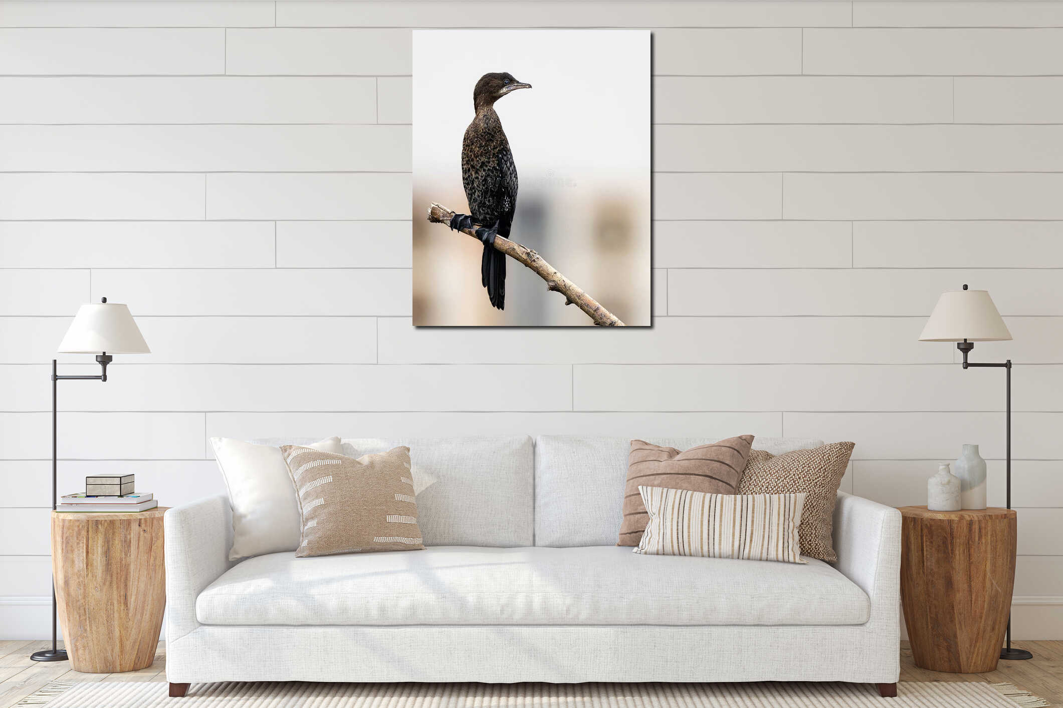 A cormorant bird perched atop a branch interior mockup
