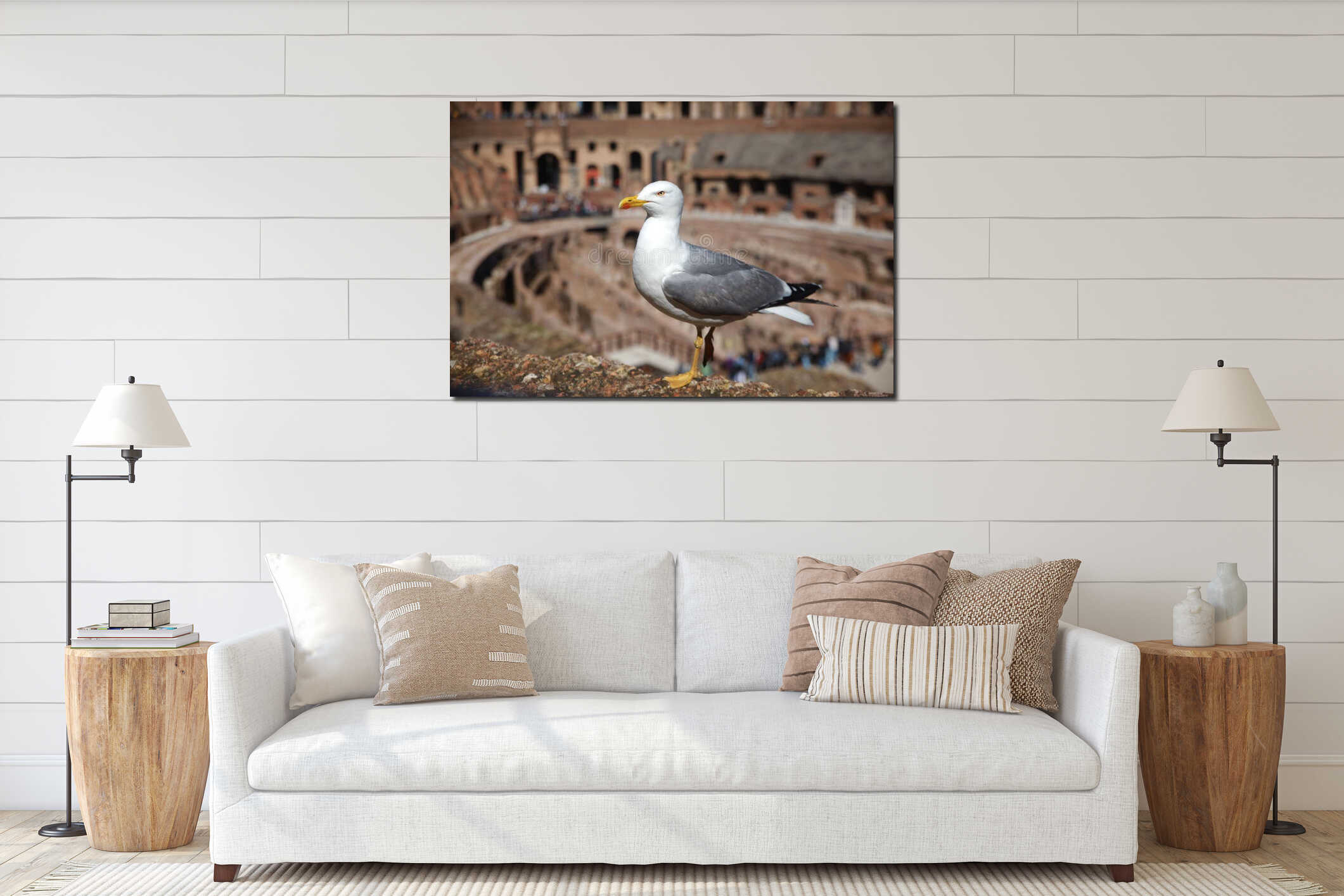 Seagull perched atop a moss covered surface with ruins in the background interior mockup