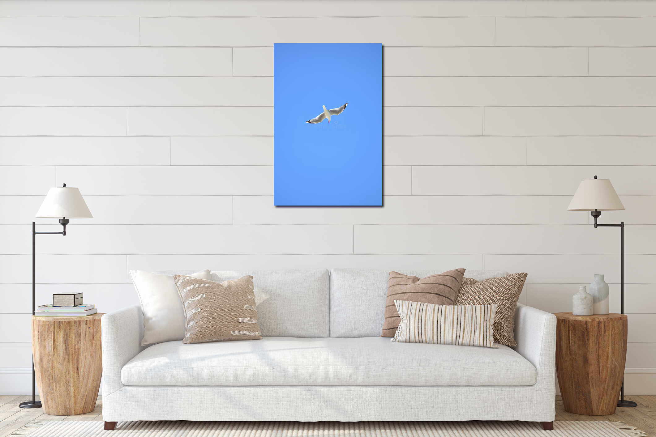 Red billed seagull flying on blue sky interior mockup