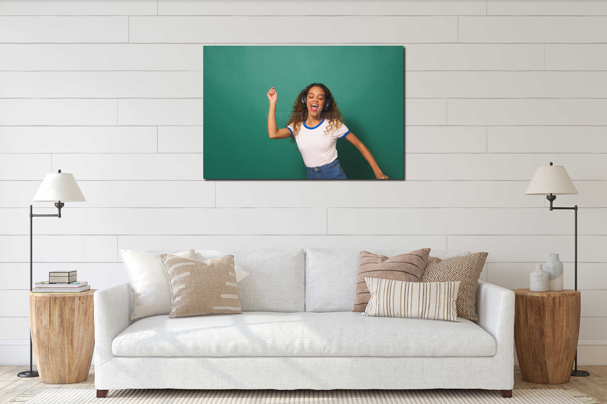 Wide shot, young biracial woman dancing with headphones, green studio background interior mockup