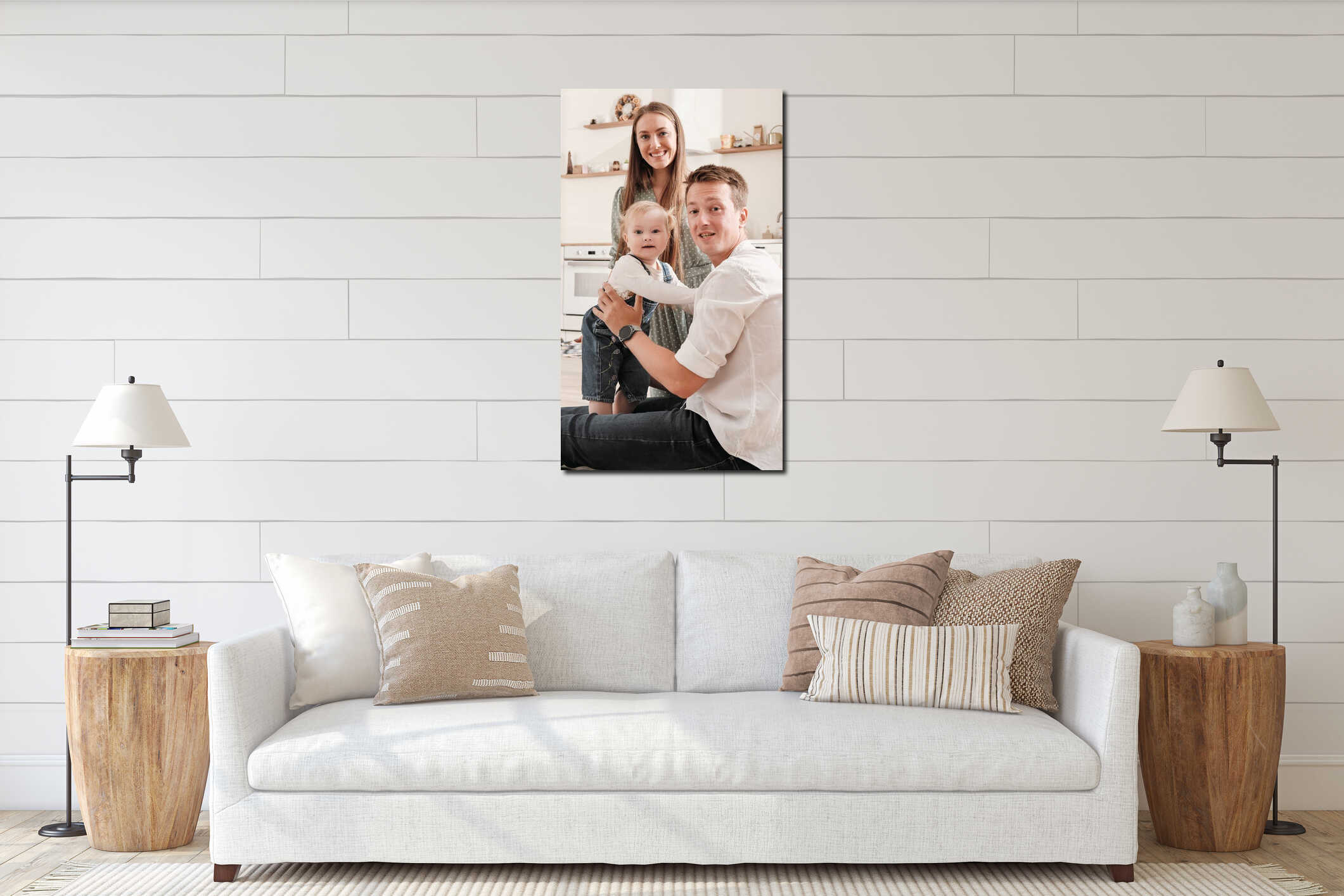 Happy family of three, mother, father and little girl looking at camera, vertical shot. Cheerful family at home in interior mockup