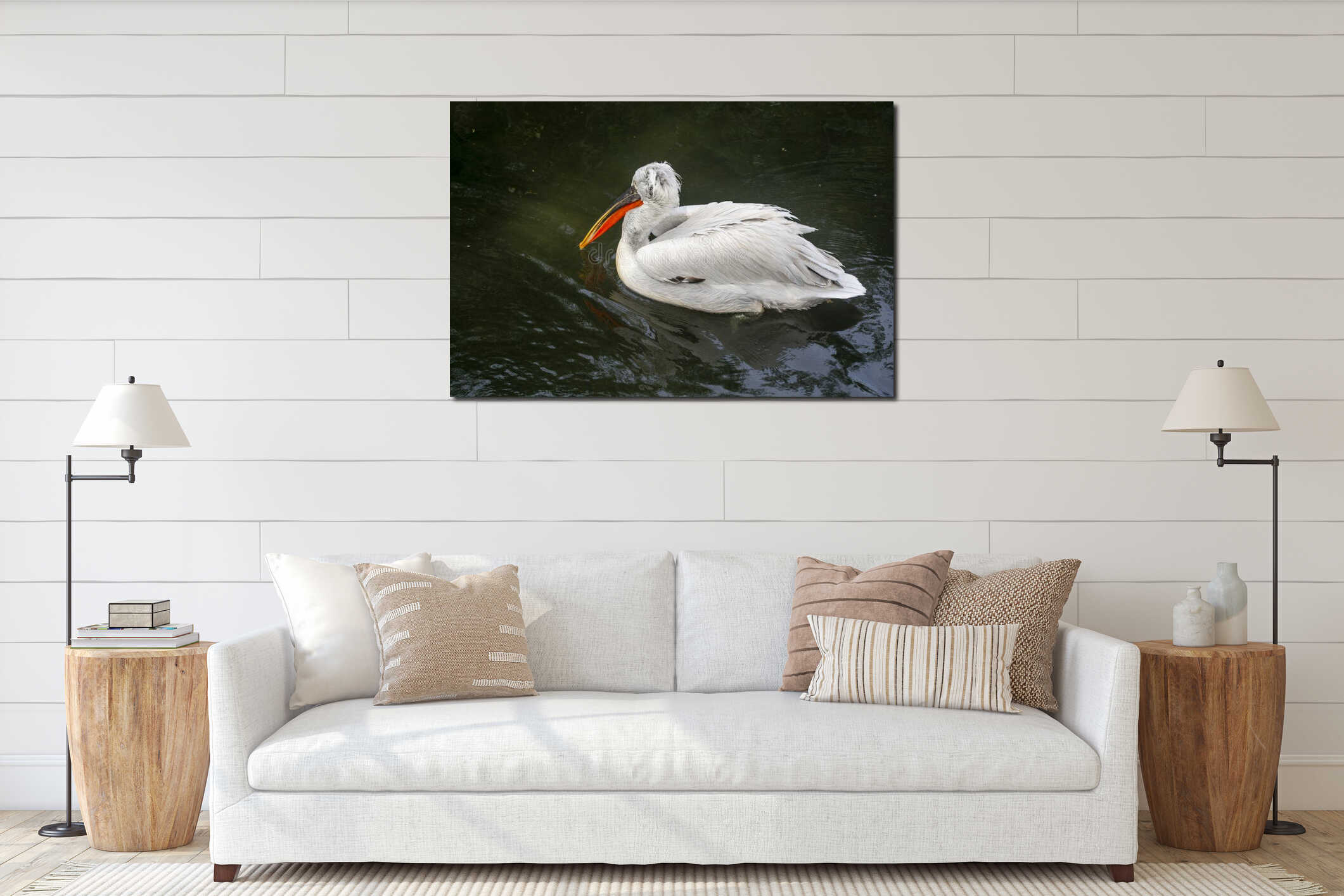 A white pelican with a bright black orange beak turned away interior mockup