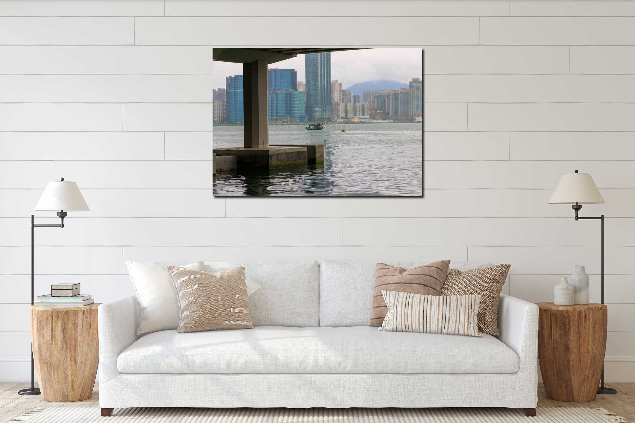 Small boat sails in Victoria Harbor by Hong Kong high rise buildings interior mockup