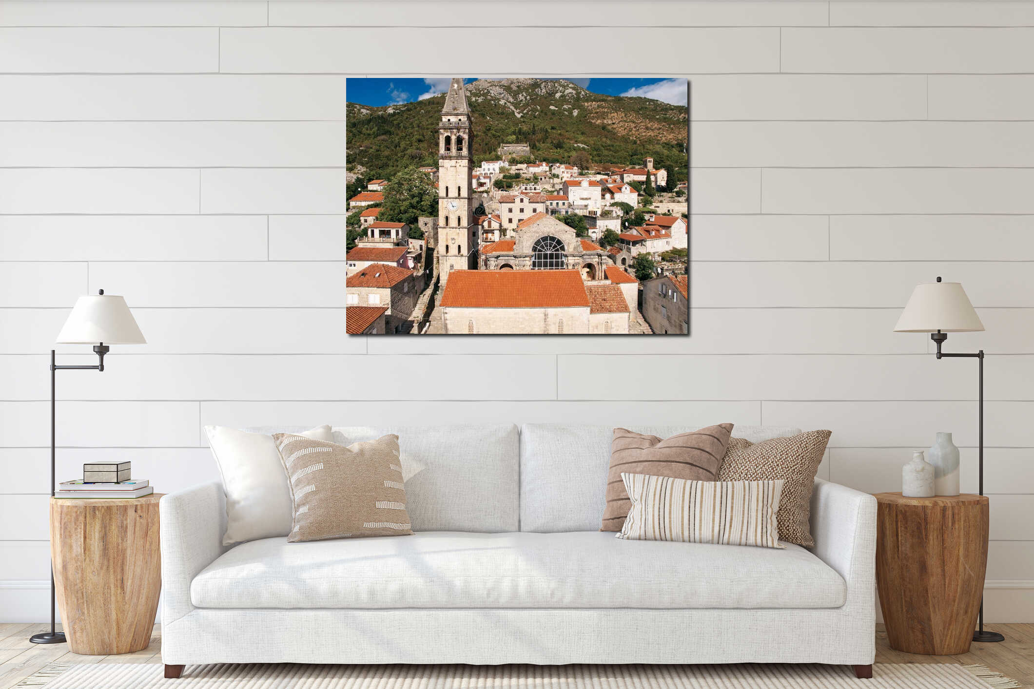 Church of St. Nicholas with a bell tower among the red roofs of ancient houses at the foot of the mountains. Perast interior mockup