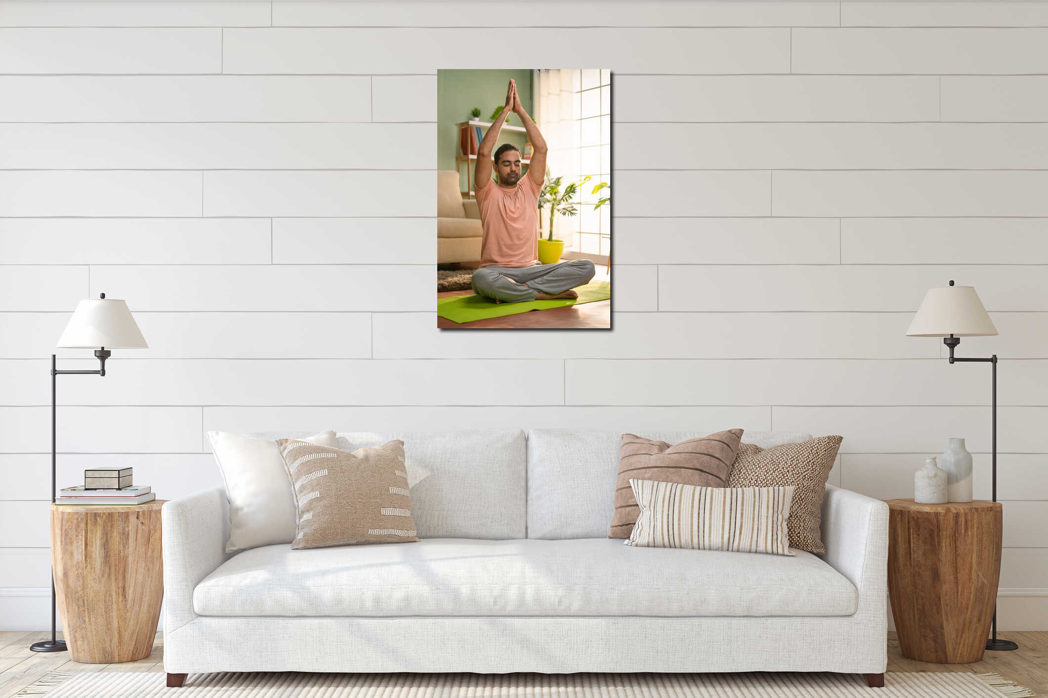 Vertical shot of young indian man doing namaste posture or yoga with eyes closed while sitting at home - concept of self interior mockup
