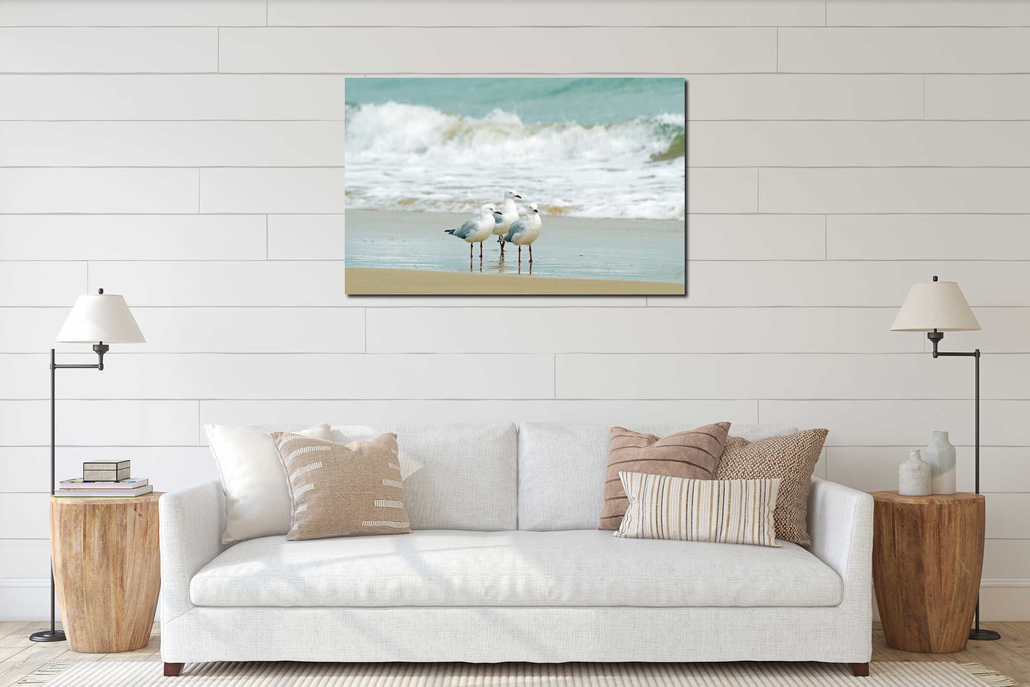 Seagulls huddled together at edge of surf waves interior mockup