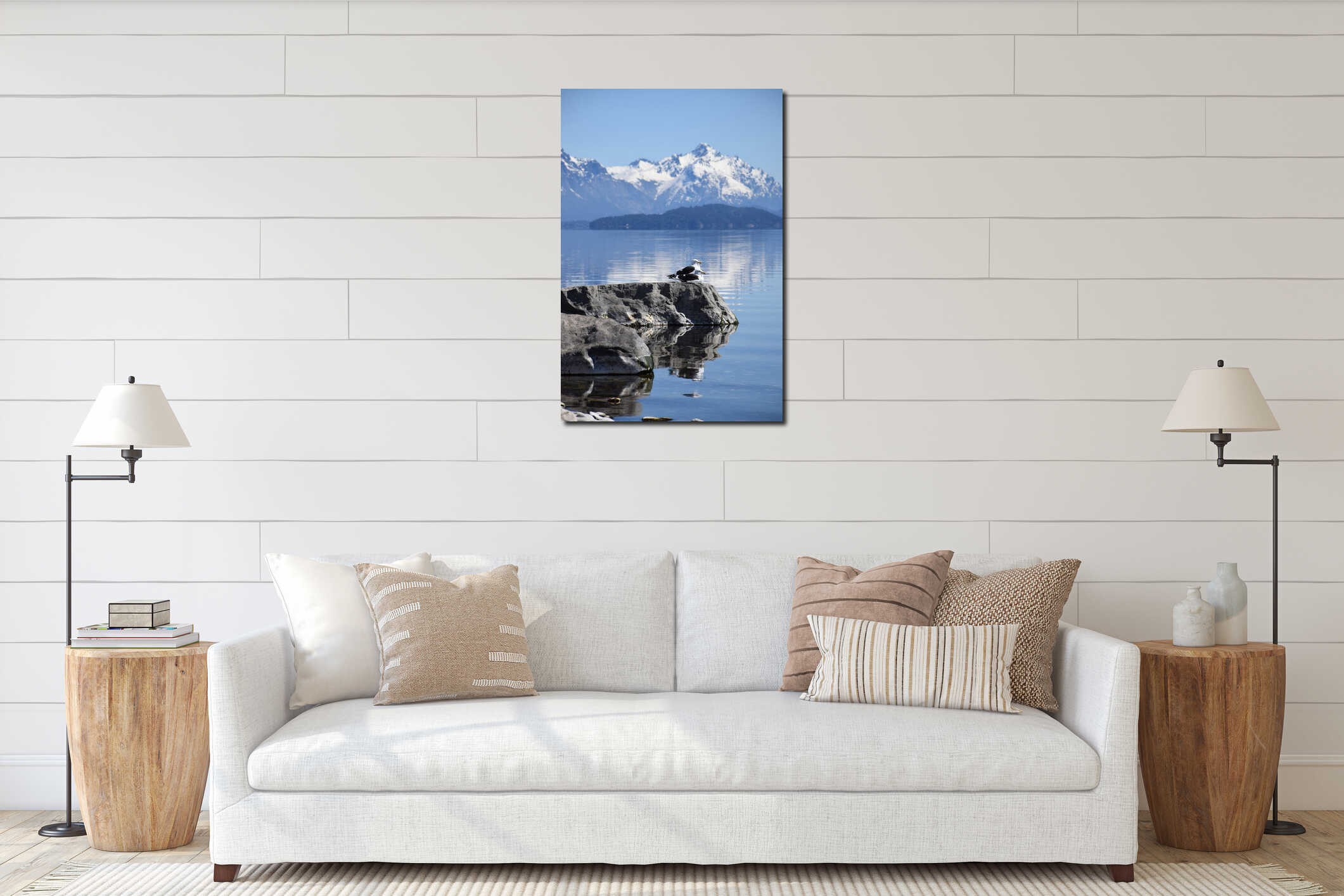 Avian Serenity: Seagull Resting on Rocky Shoreline Near Snowy Alpine Lake interior mockup