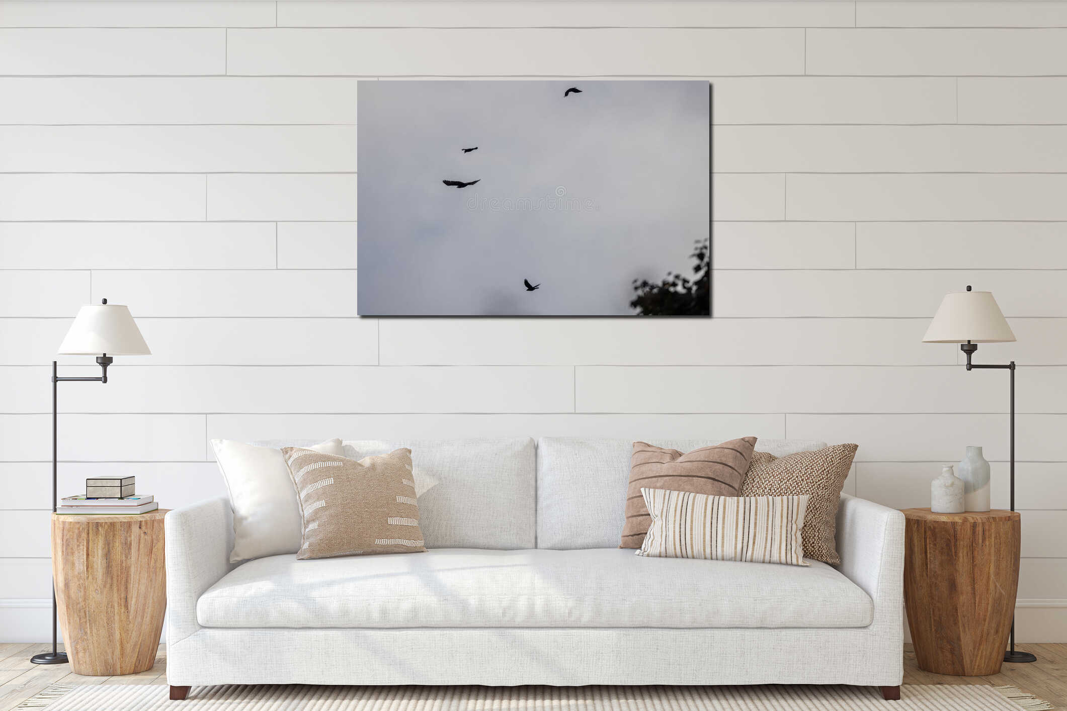 Birds flying near large trees and cloudy skies interior mockup