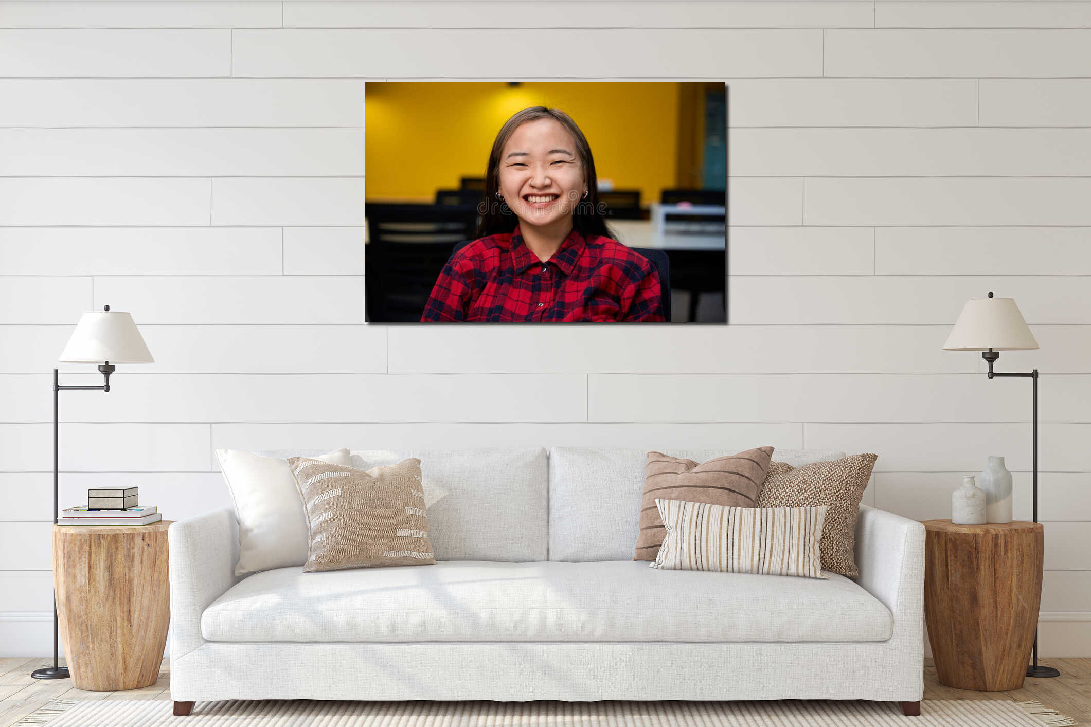 Portrait of young pleased asian female IT employee looking at camera interior mockup