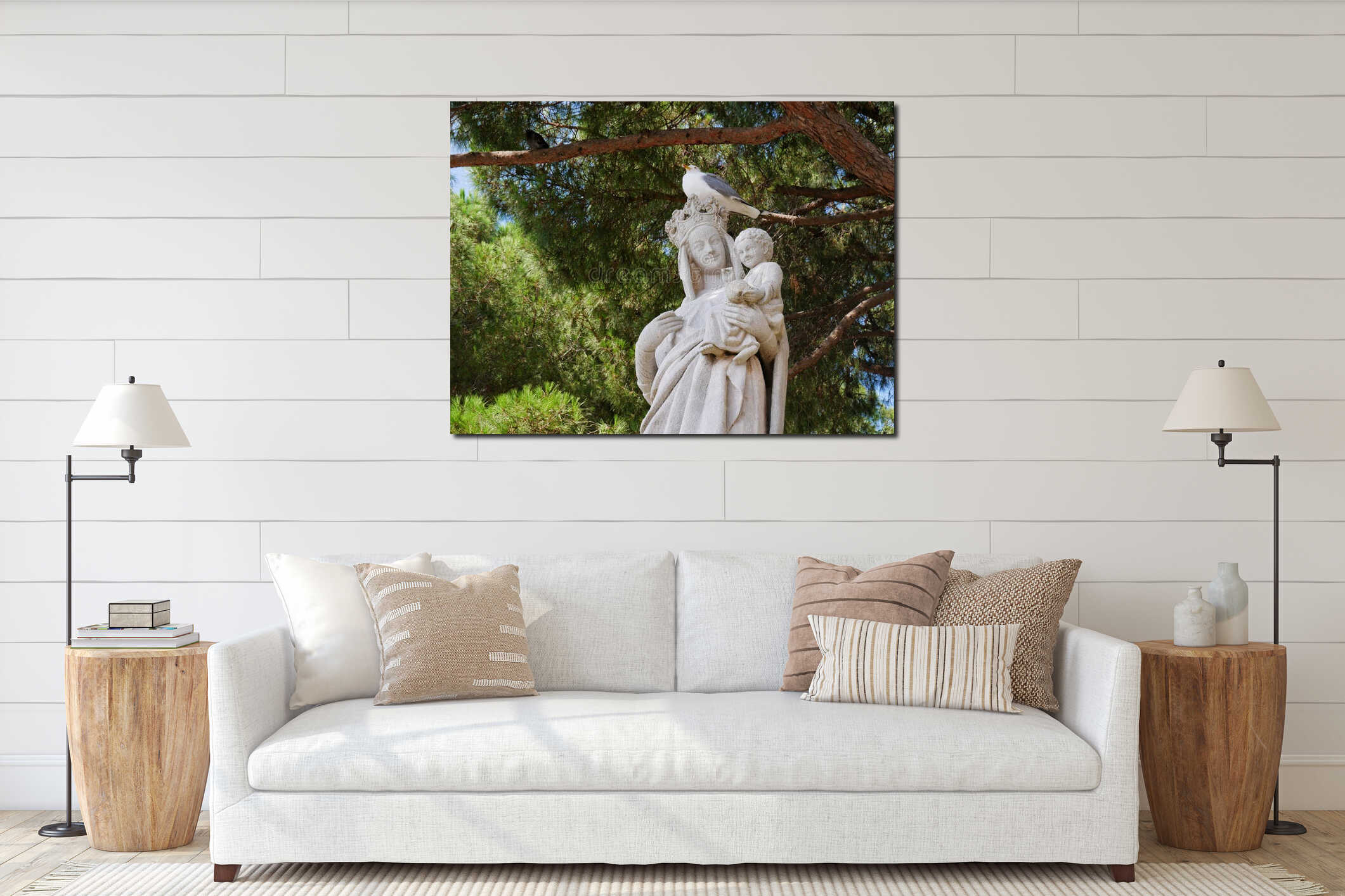 A seagull sits on a a head of a statue of the Saint Mary in the old town of Cannes, Chateau de la Castre interior mockup