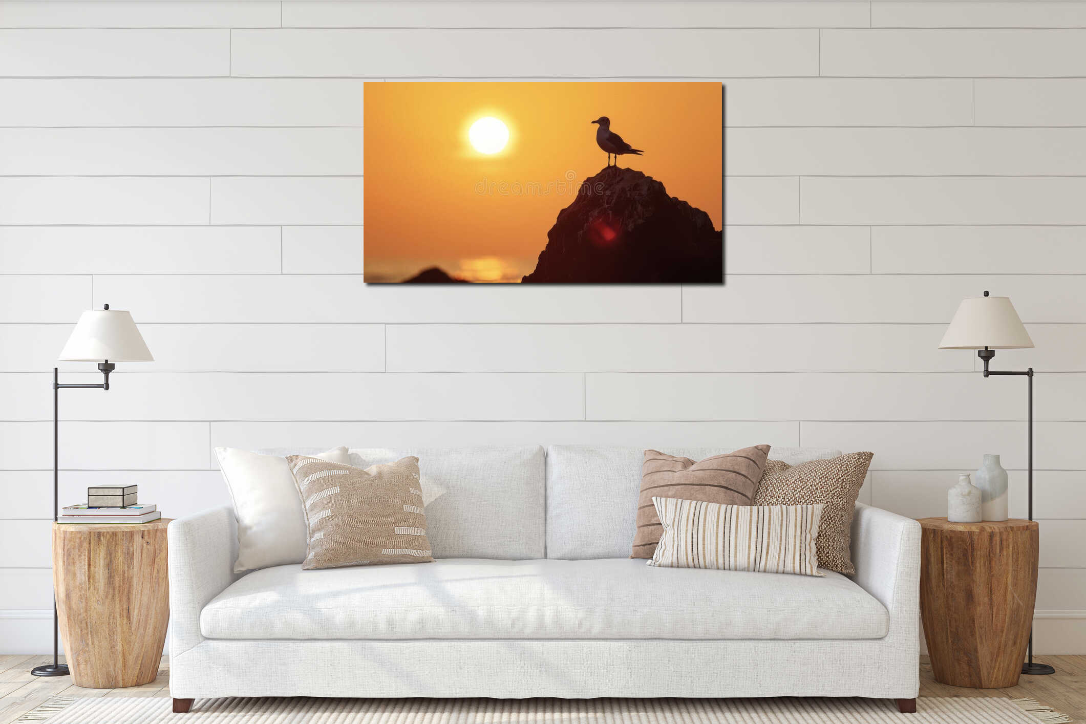 A lone seagull perched on a rock its silhouette illuminated against the dazzling backdrop of the setting sun interior mockup