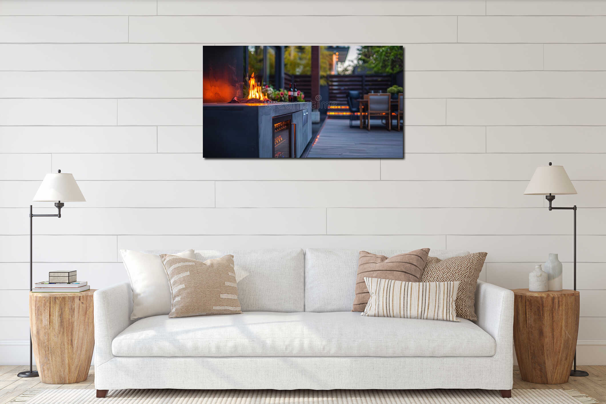 A stylish outdoor patio boasts a sleek fireplace with a builtin wine fridge for entertaining. The warm flames provide a interior mockup