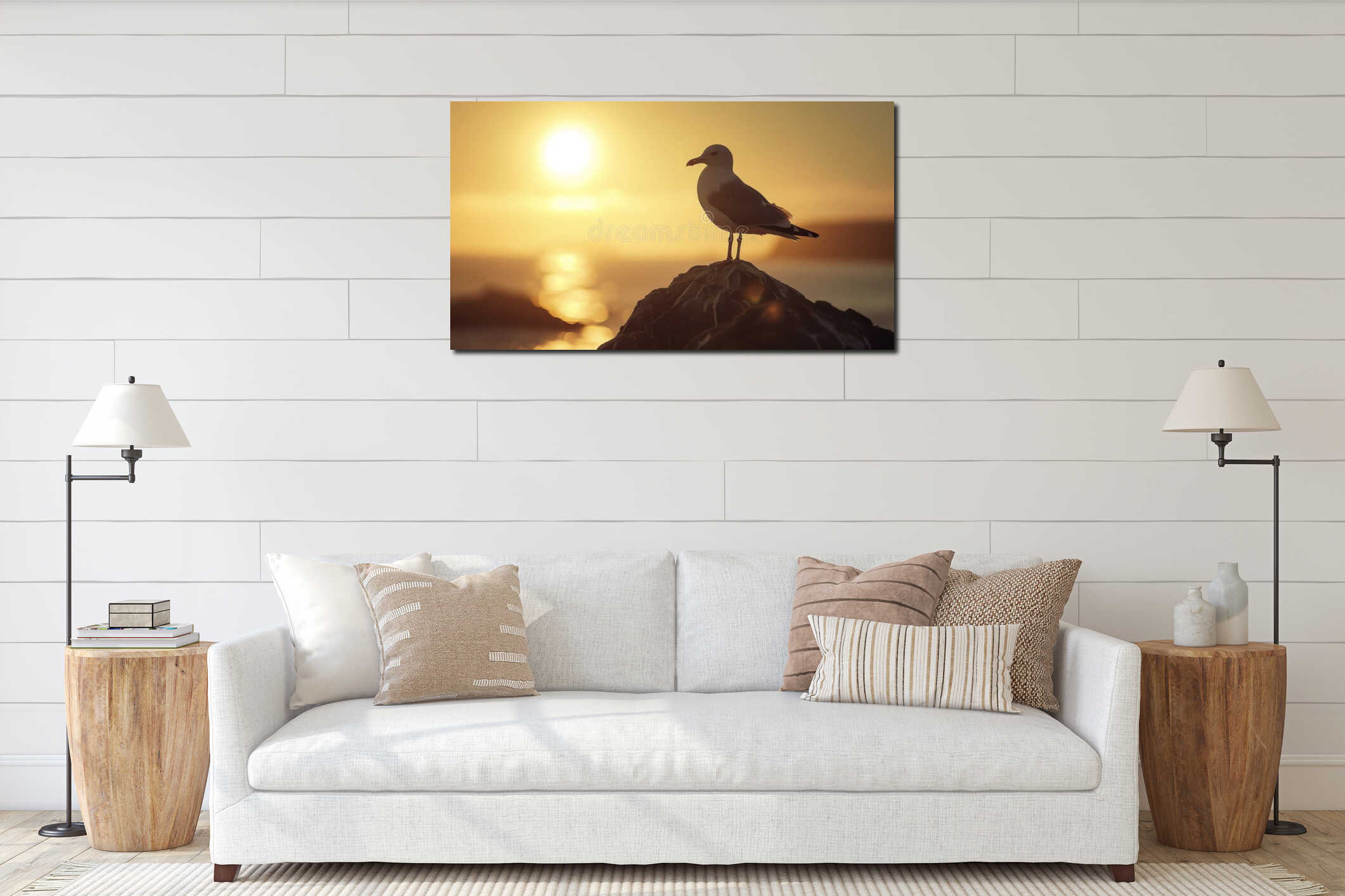 A lone seagull perched on a rock its stunning silhouette against the bright sun flare creating a pictureperfect moment interior mockup