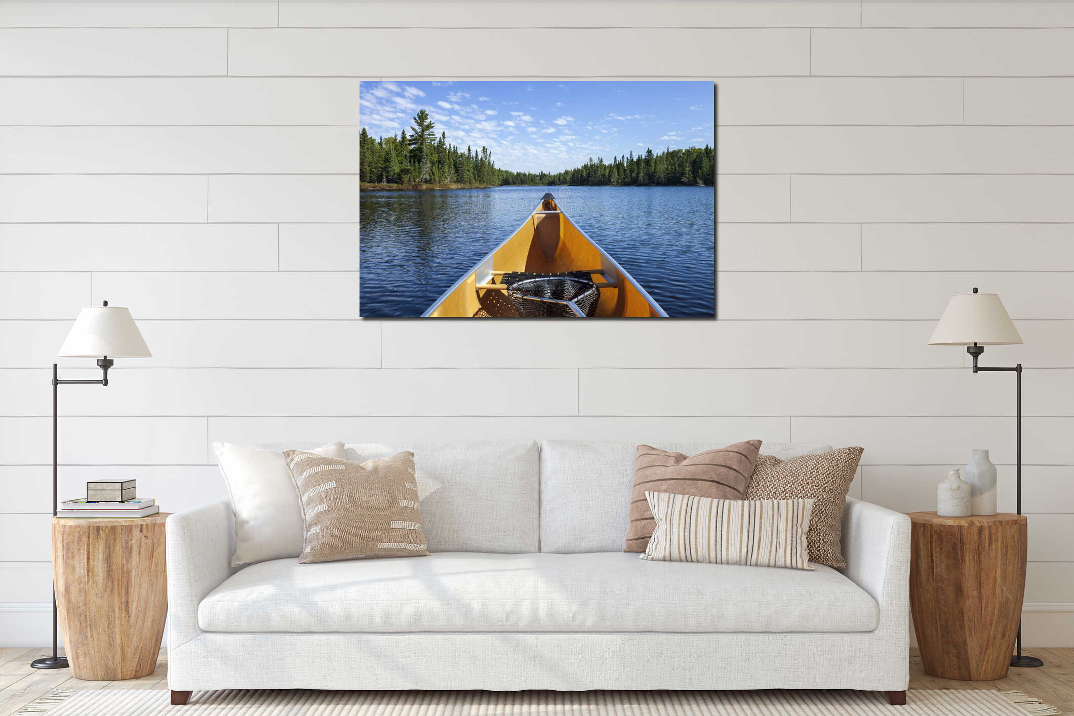 Yellow canoe with fishing net on a blue lake with pines along the shore on a sunny summer afternoon in northern Minnesota interior mockup
